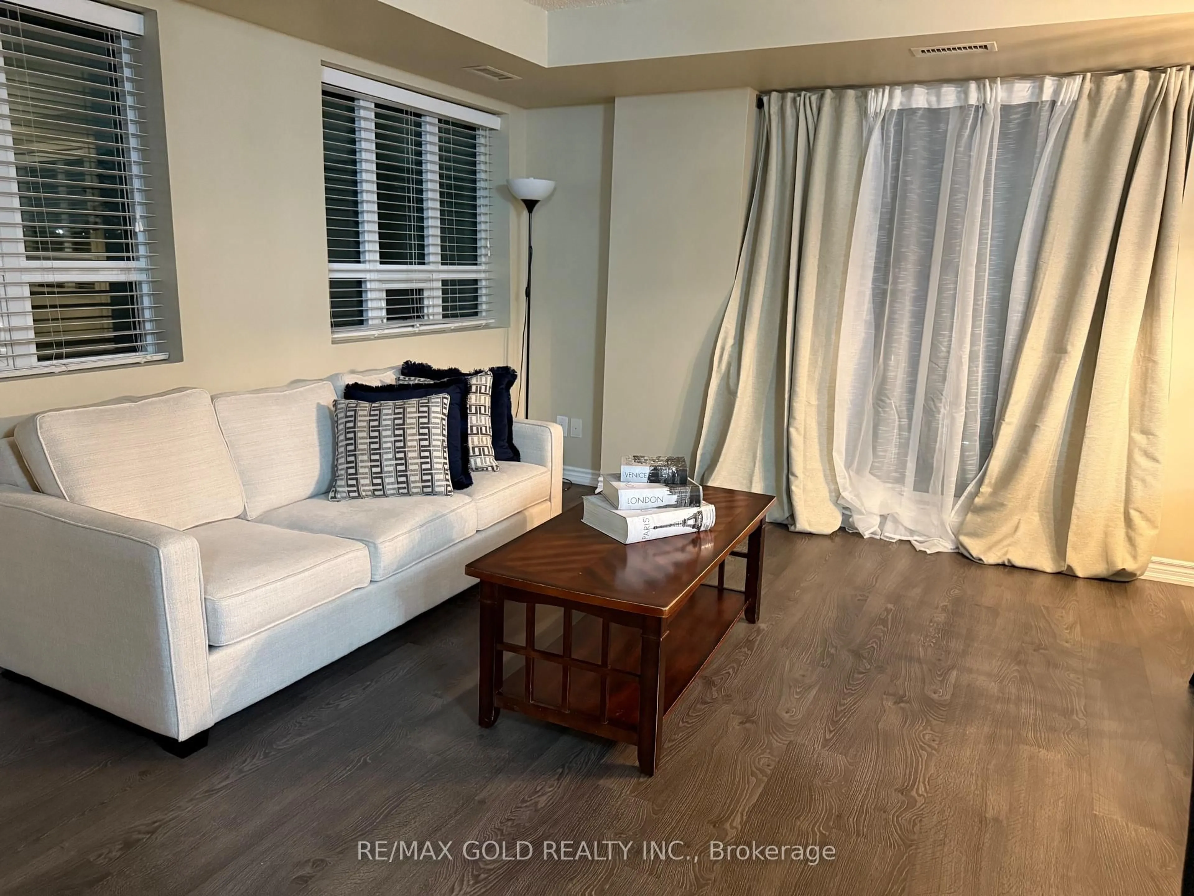 Living room with furniture, wood/laminate floor for 7730 Kipling Ave #311, Vaughan Ontario L4L 1Y9