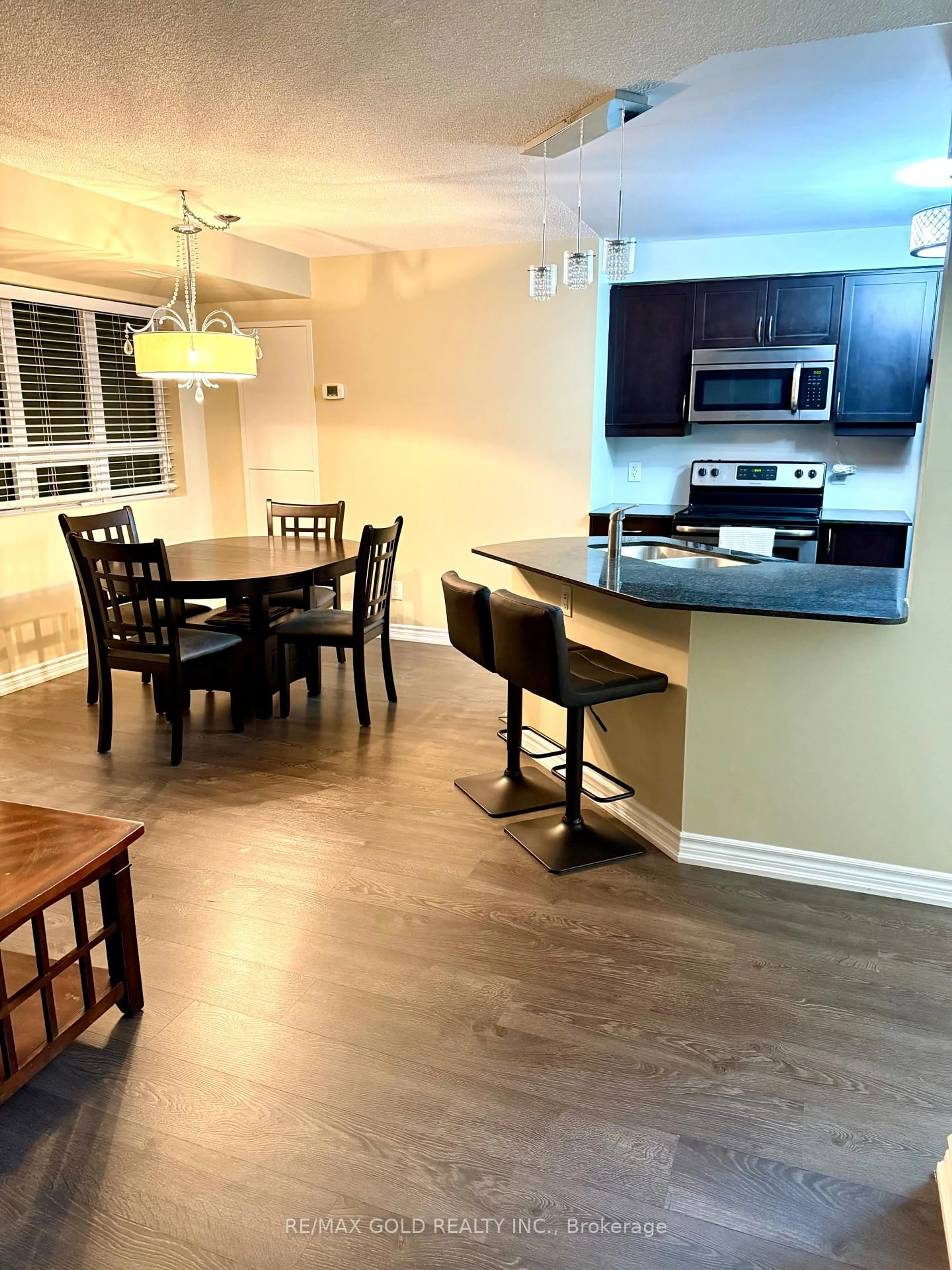 Open concept kitchen, wood/laminate floor for 7730 Kipling Ave #311, Vaughan Ontario L4L 1Y9