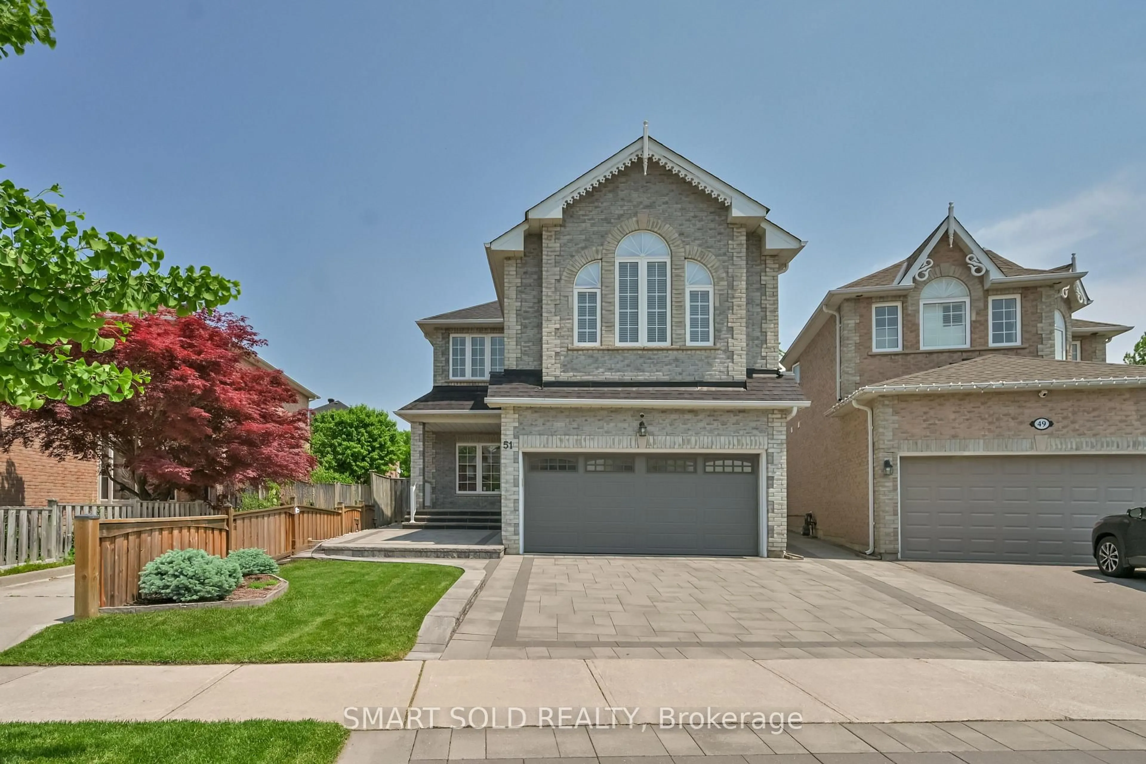 Home with brick exterior material, street for 51 Houndsbrook Cres, Markham Ontario L3P 7X9