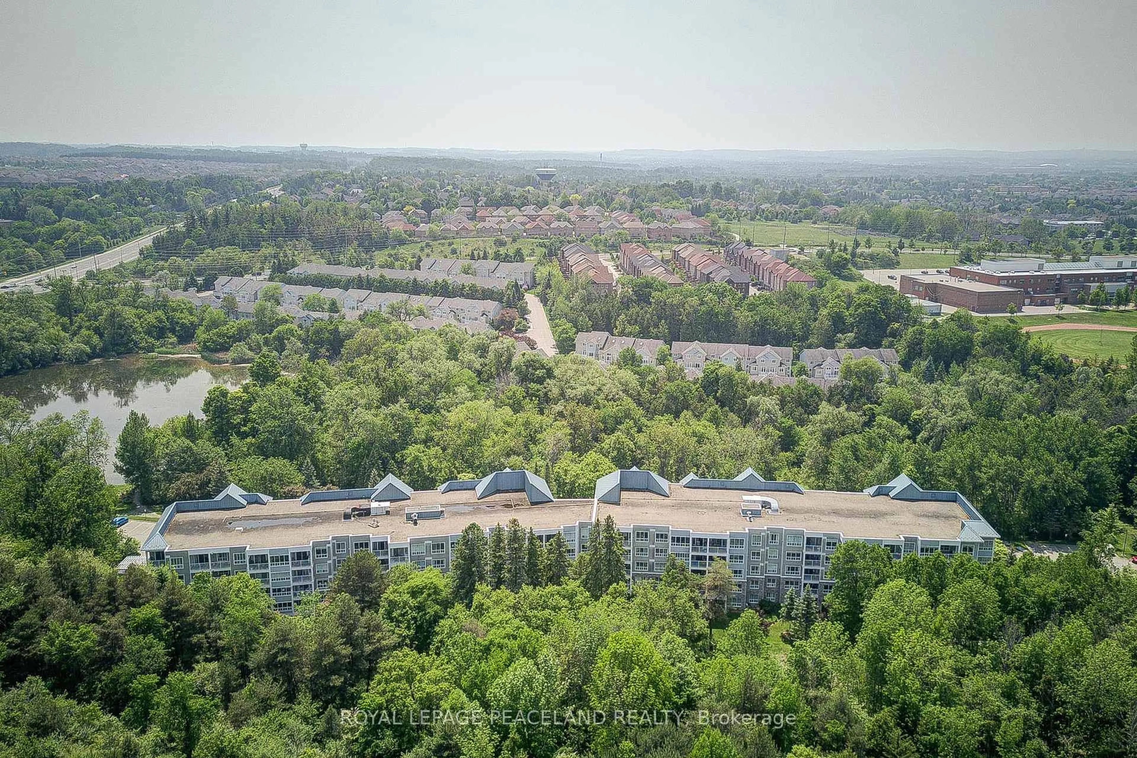 A pic from outside/outdoor area/front of a property/back of a property/a pic from drone, forest/trees view for 900 Bogart Mill Tr #520, Newmarket Ontario L3Y 8V5