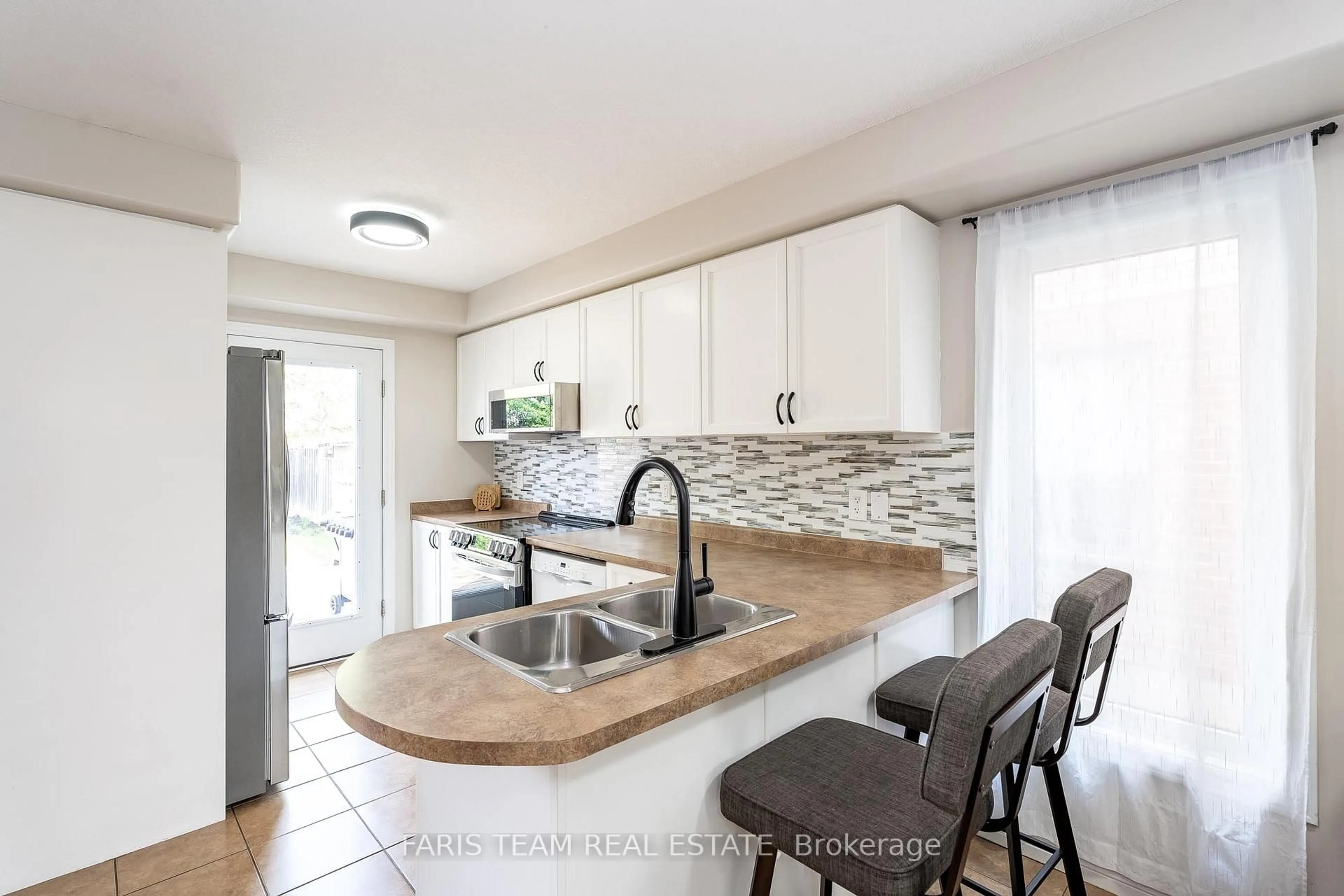 Open concept kitchen, ceramic/tile floor for 34 Quigley St, Essa Ontario L0M 1B5