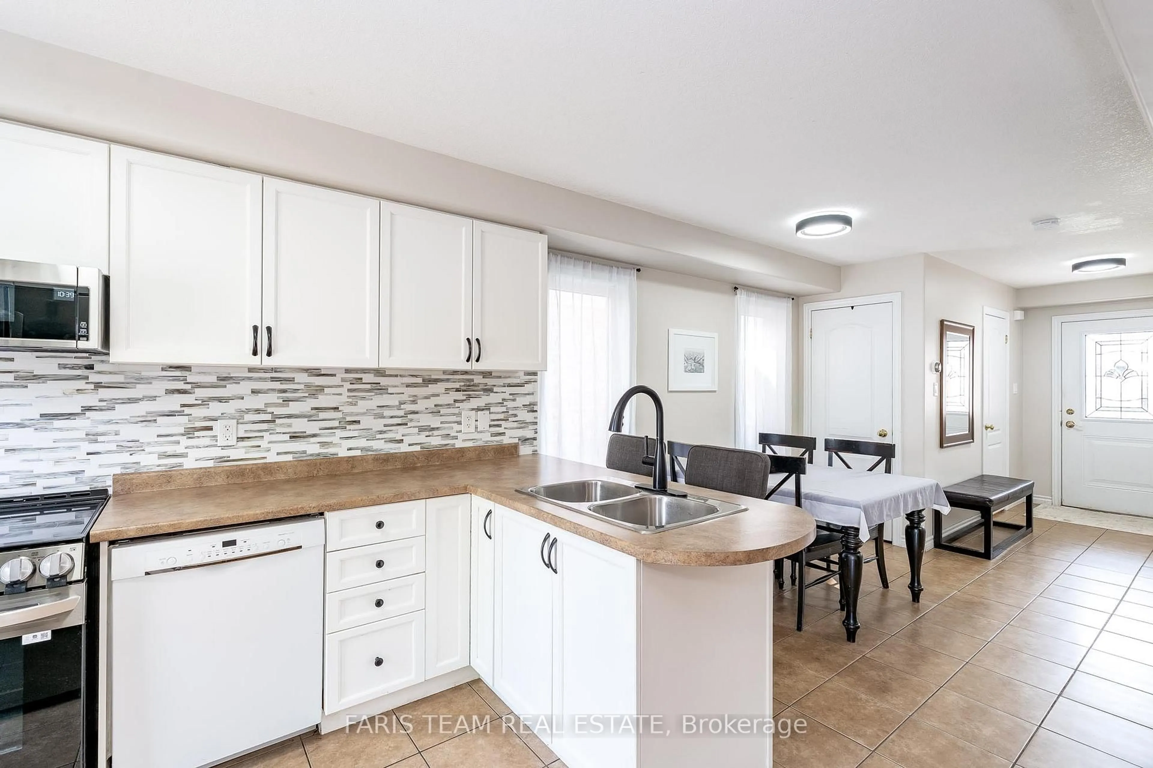 Open concept kitchen, ceramic/tile floor for 34 Quigley St, Essa Ontario L0M 1B5