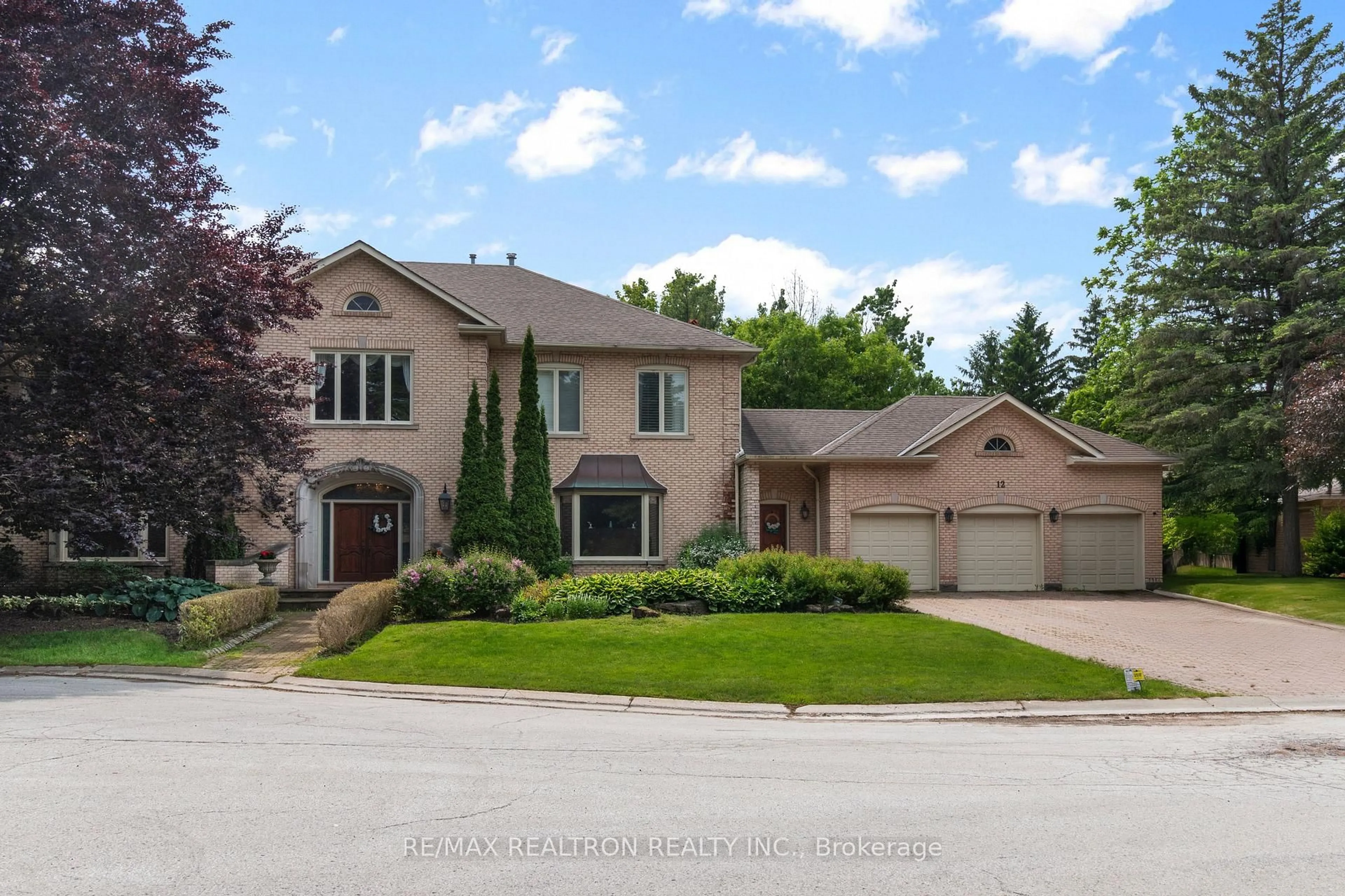 Home with brick exterior material, street for 12 Moodie Dr, Richmond Hill Ontario L4C 8C9