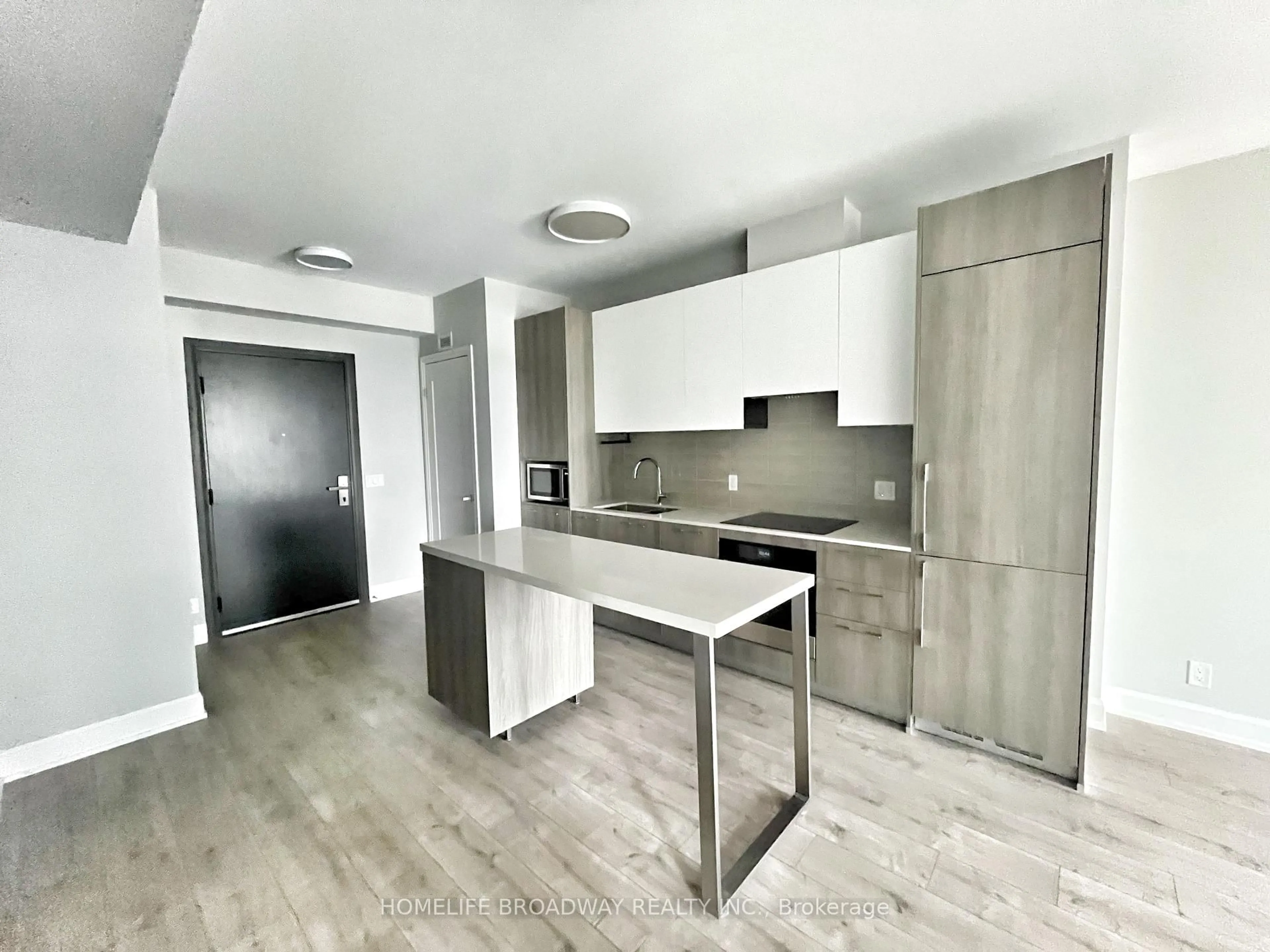 Open concept kitchen, wood/laminate floor for 38 Water Walk Dr #827, Markham Ontario L3R 6M8