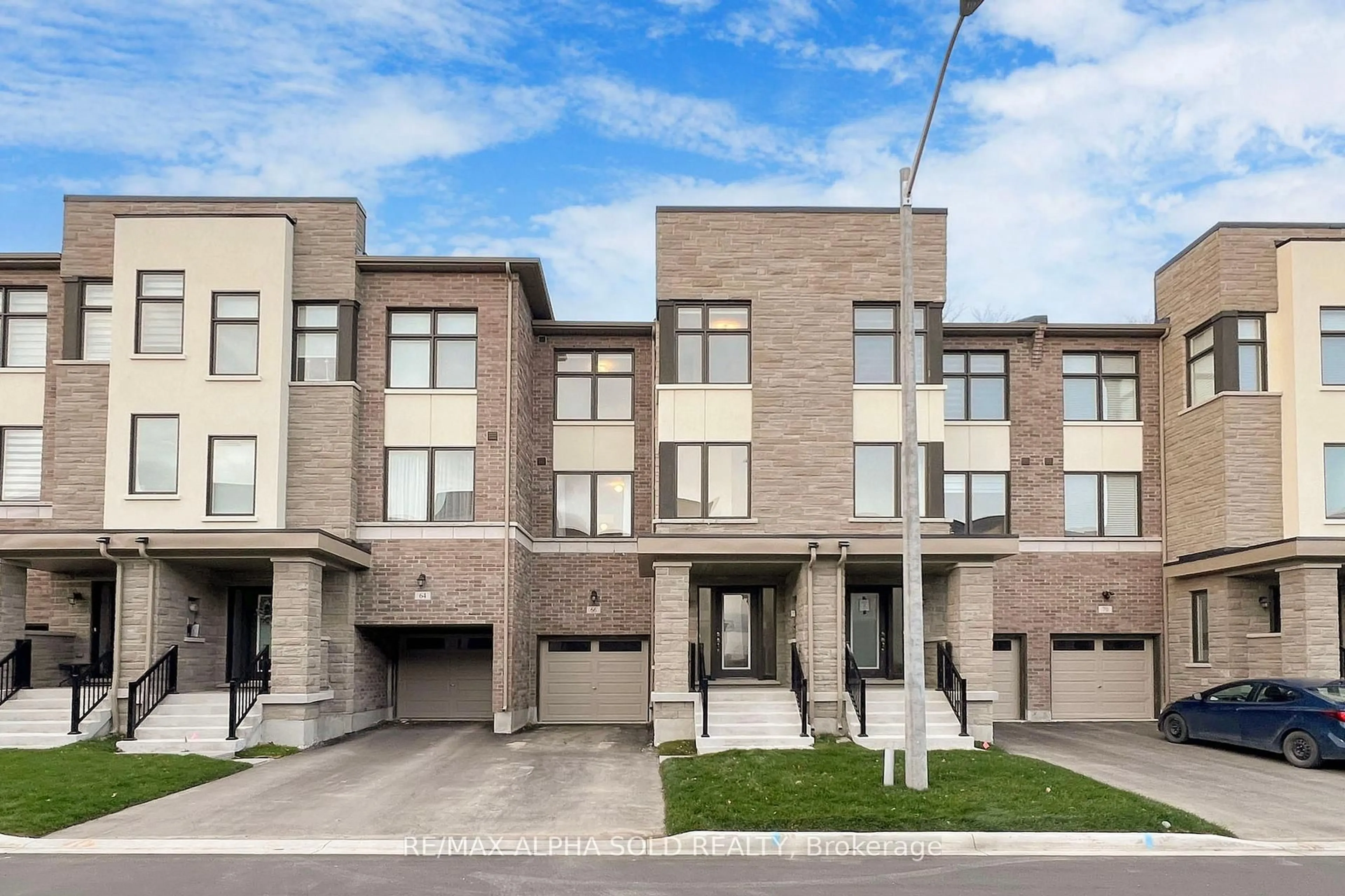 Home with brick exterior material, street for 66 Puisaya Dr, Richmond Hill Ontario L4E 1L2