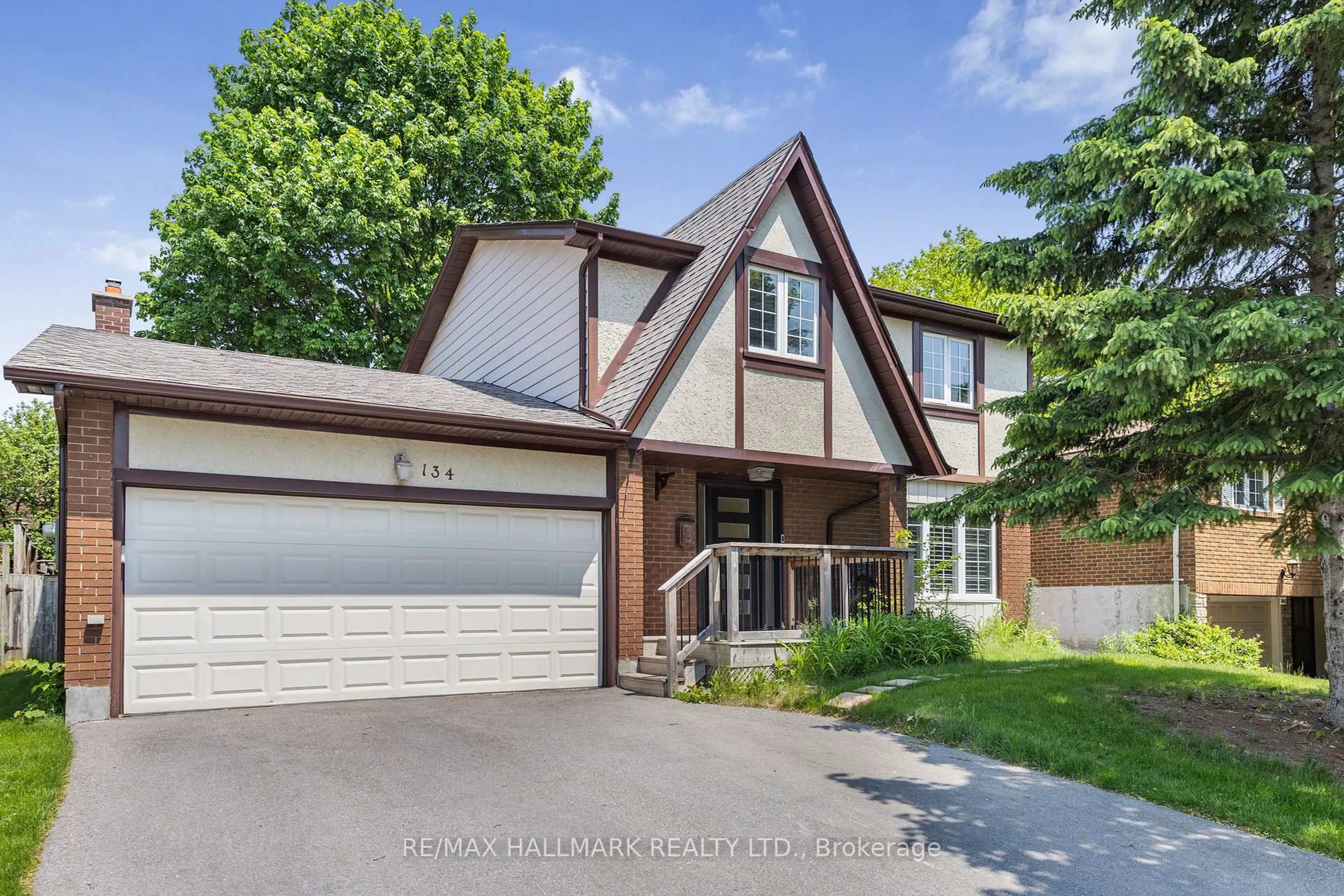 Home with brick exterior material, street for 134 Romfield Crct, Markham Ontario L3T 3H9