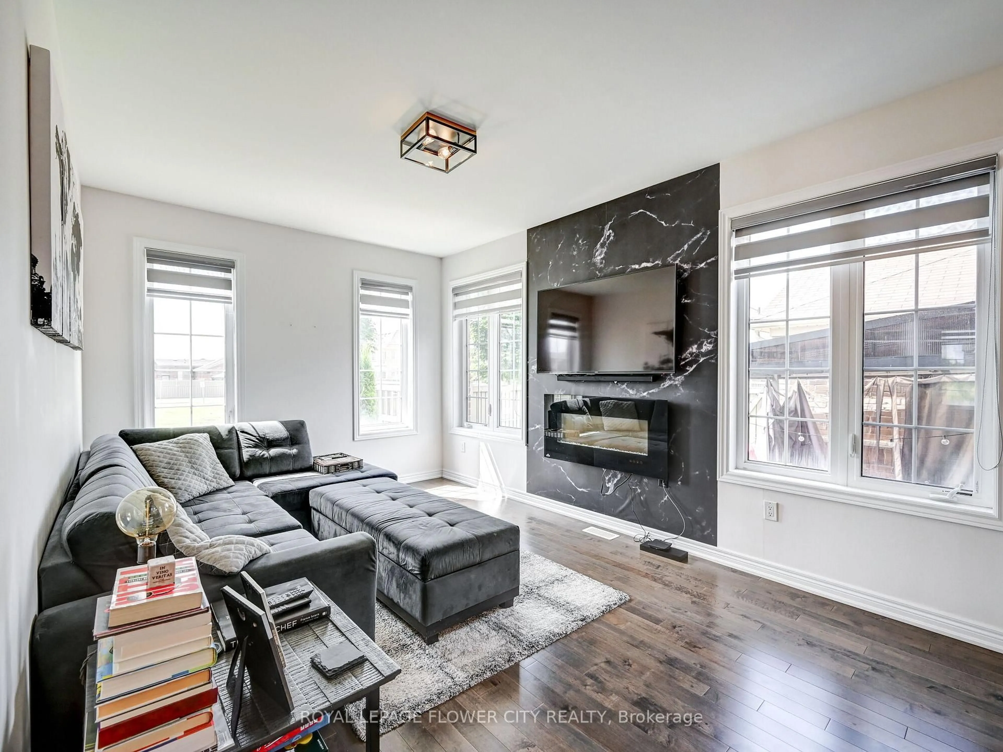Living room with furniture, wood/laminate floor for 302 Barons St, Vaughan Ontario L4H 4H4
