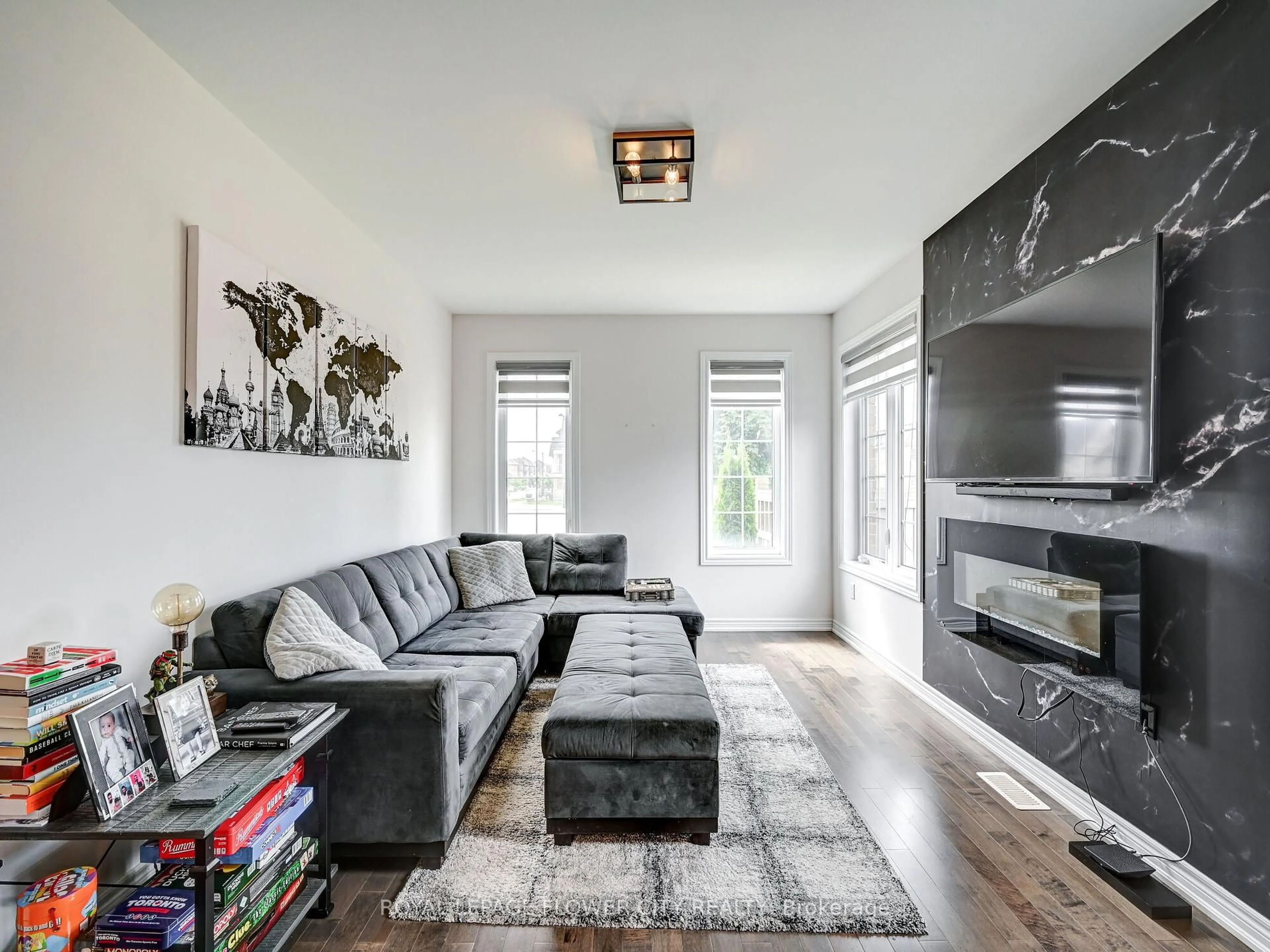 Living room with furniture, wood/laminate floor for 302 Barons St, Vaughan Ontario L4H 4H4