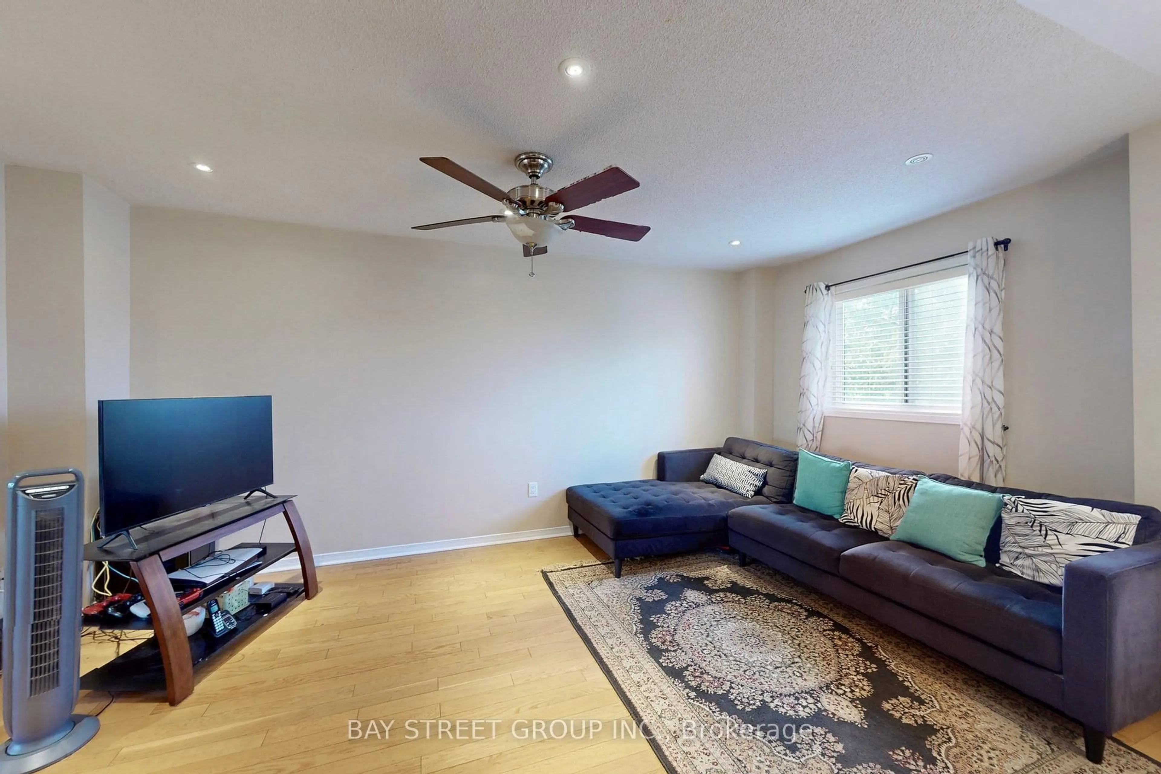 Living room with furniture, wood/laminate floor for 4 Red Sea Way, Markham Ontario L3S 4T5