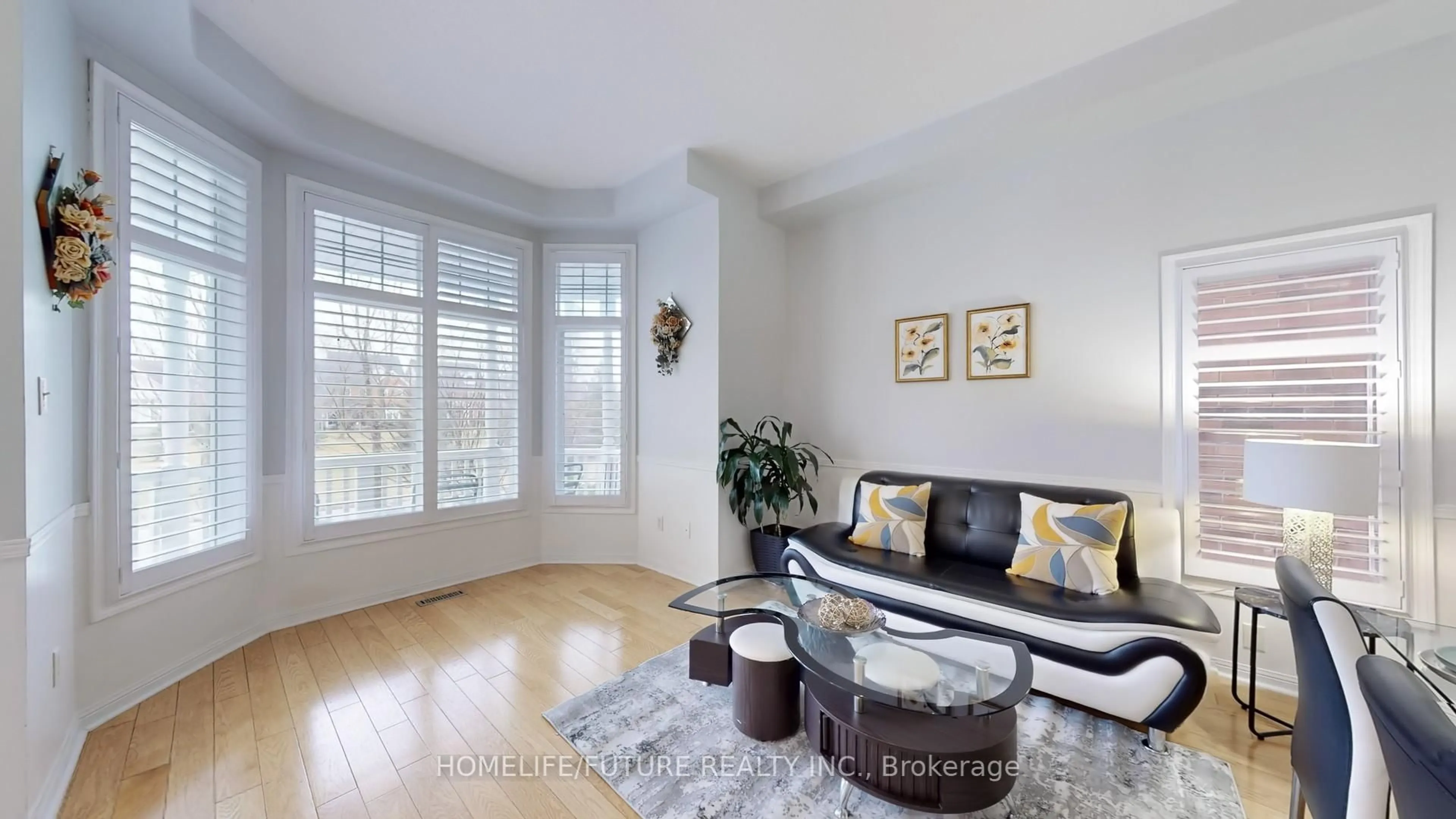 Living room with furniture, wood/laminate floor for 24 Christian Reesor Park #Ave, Markham Ontario L6B 1B6