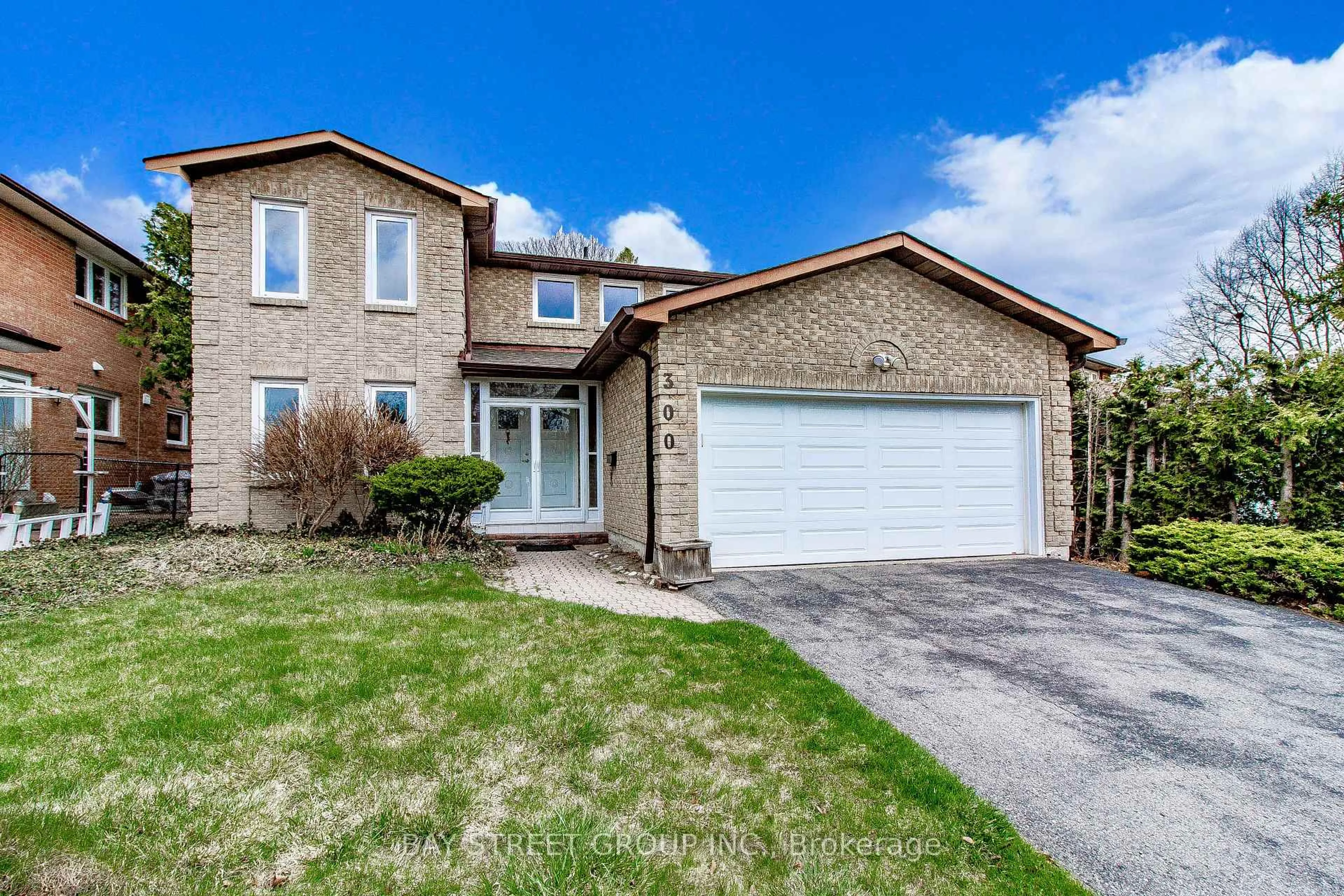 Home with brick exterior material, street for 300 Fincham Ave, Markham Ontario L3P 4E7