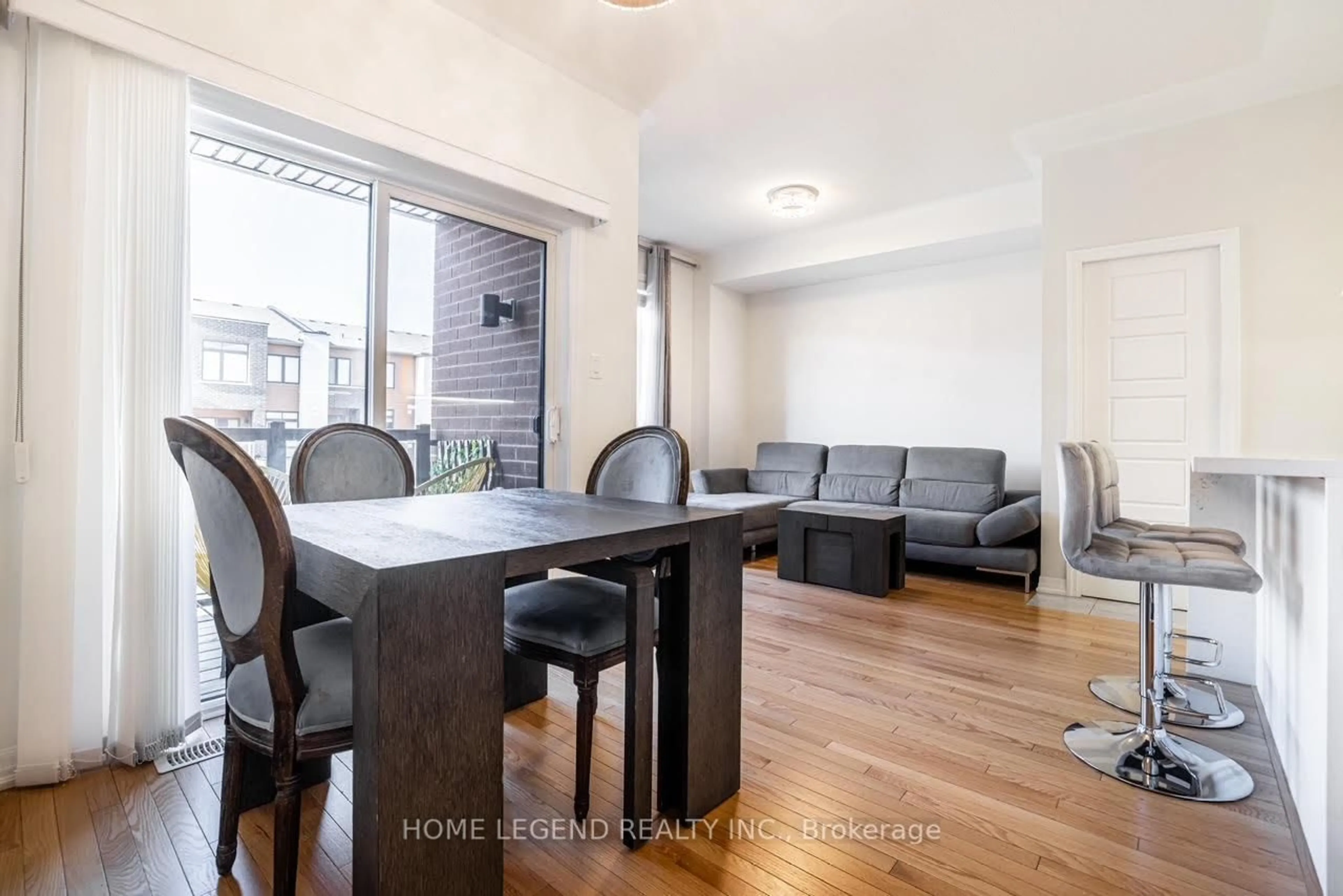 Living room with furniture, wood/laminate floor for 123 Bravo Lane, Newmarket Ontario L3X 0L2