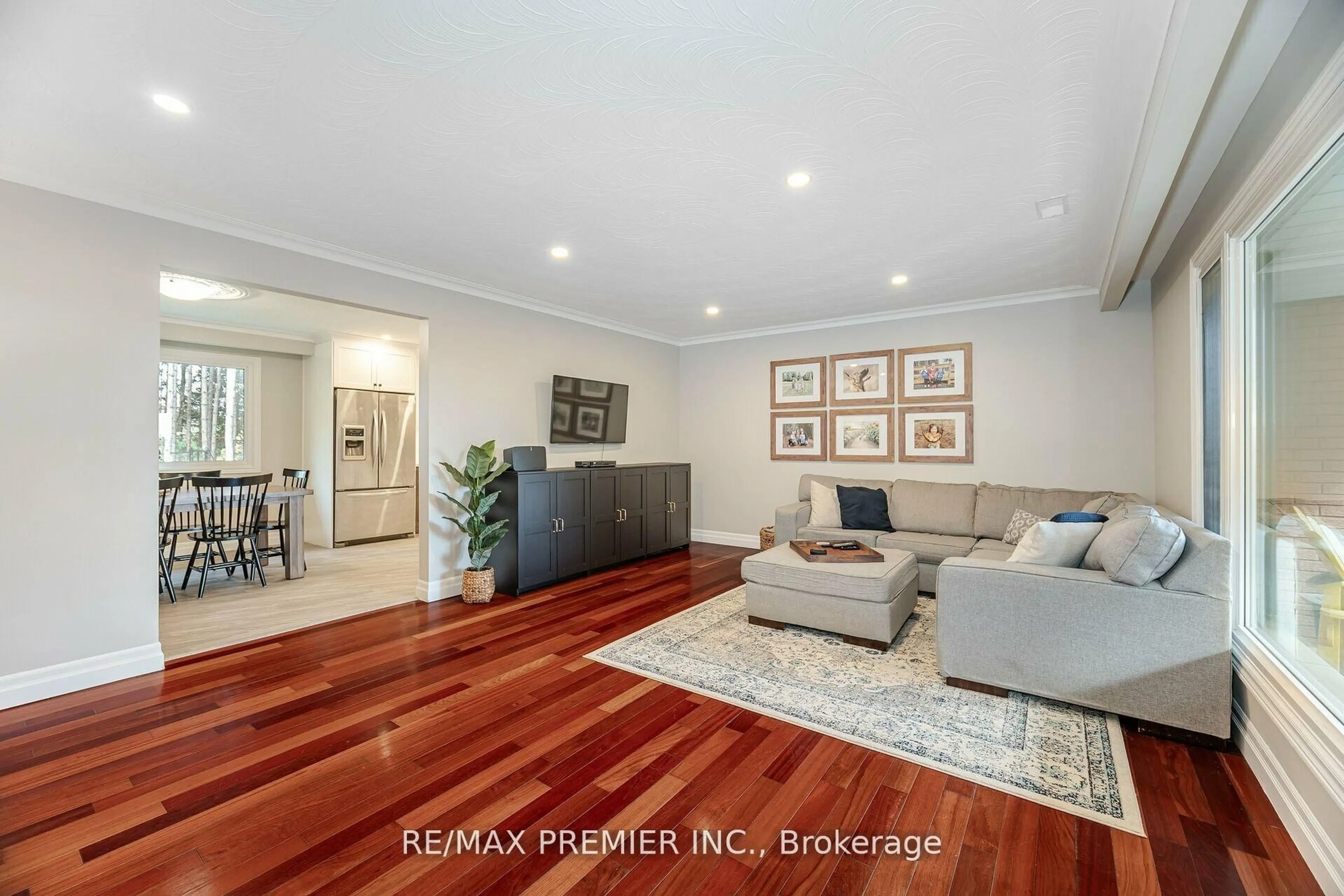Living room with furniture, wood/laminate floor for 4904 10th Sdrd, Essa Ontario L0L 2N0