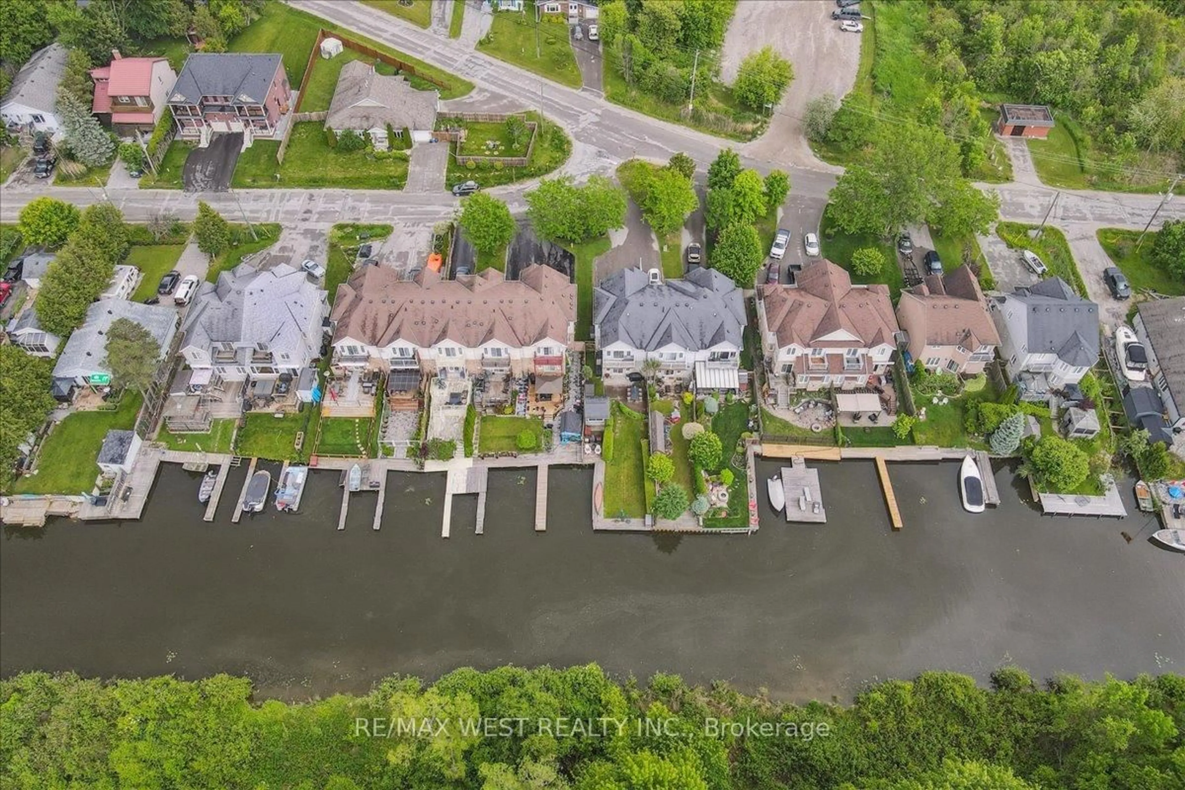 A pic from outside/outdoor area/front of a property/back of a property/a pic from drone, water/lake/river/ocean view for 2B Robert St, Georgina Ontario L4P 1K7