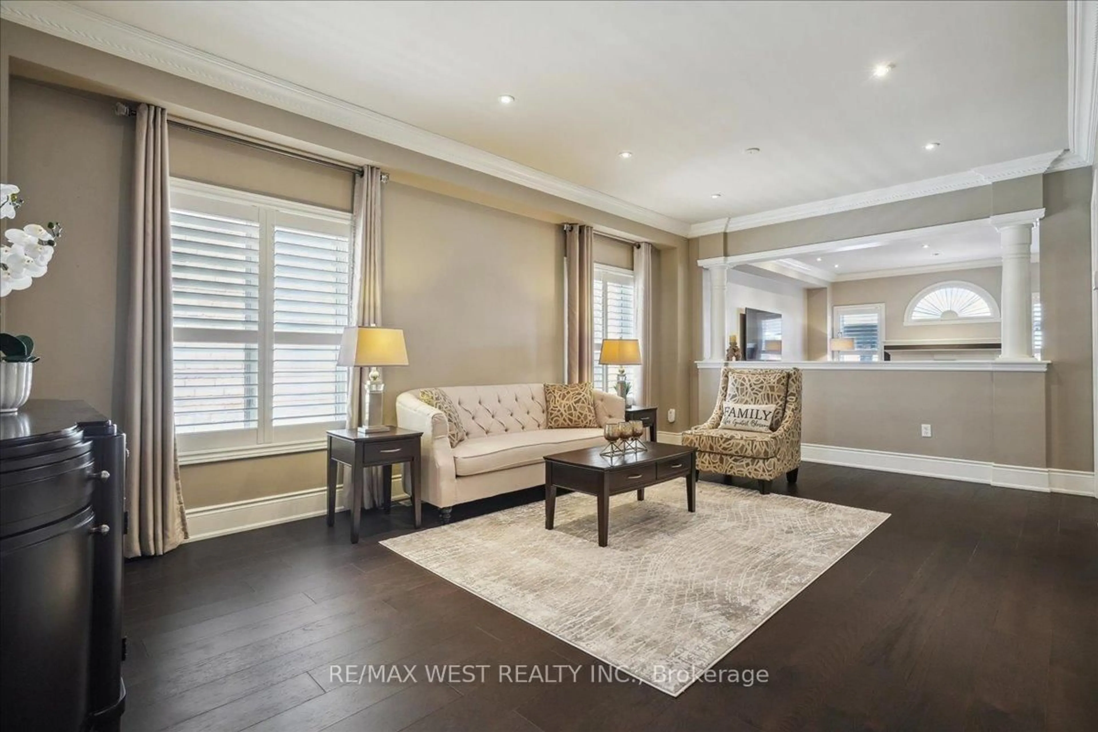 Living room with furniture, wood/laminate floor for 206 Shelbourne Dr, Vaughan Ontario L4H 0J4