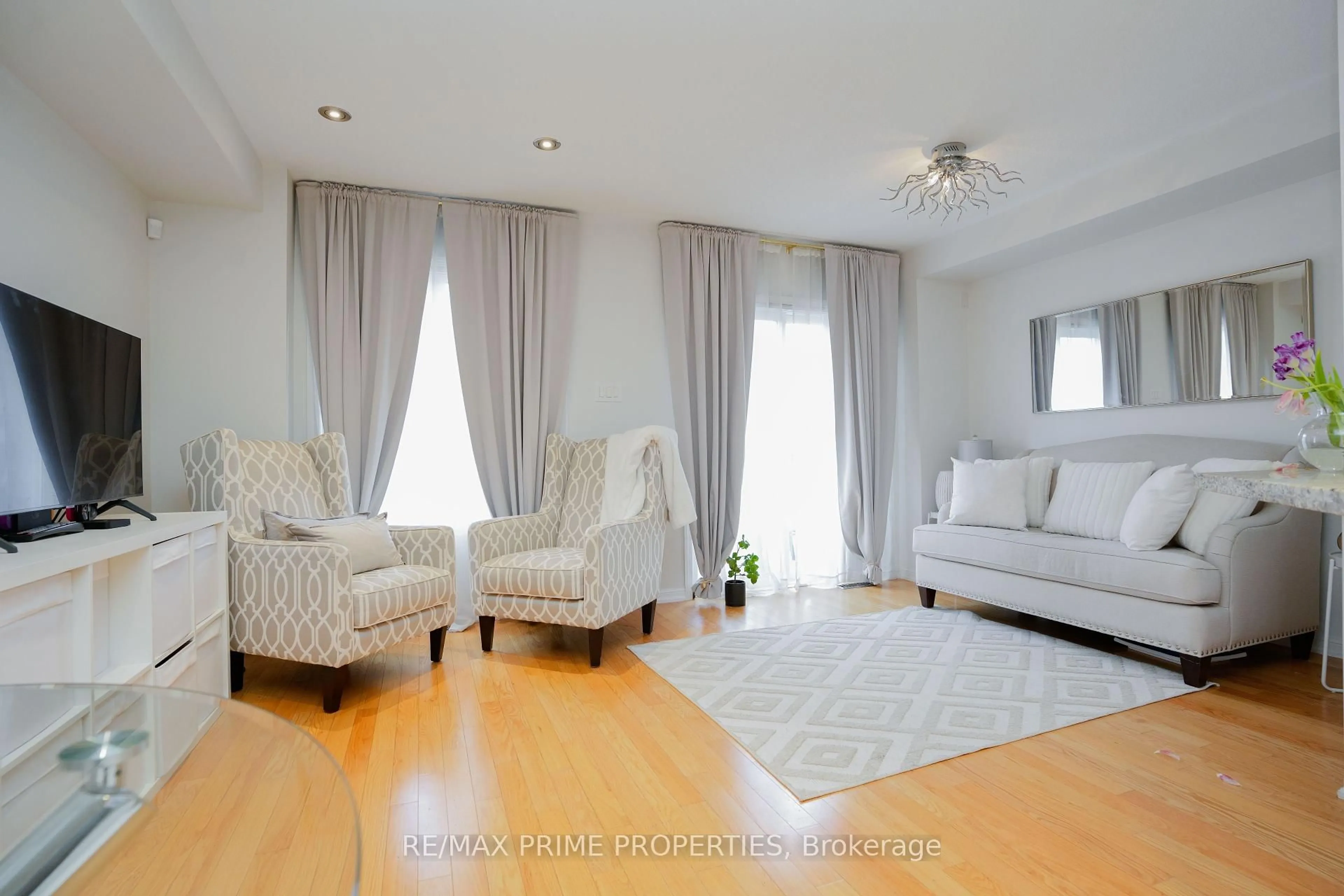 Living room with furniture, wood/laminate floor for 47 Edwin Pearson St, Aurora Ontario L4G 0S1