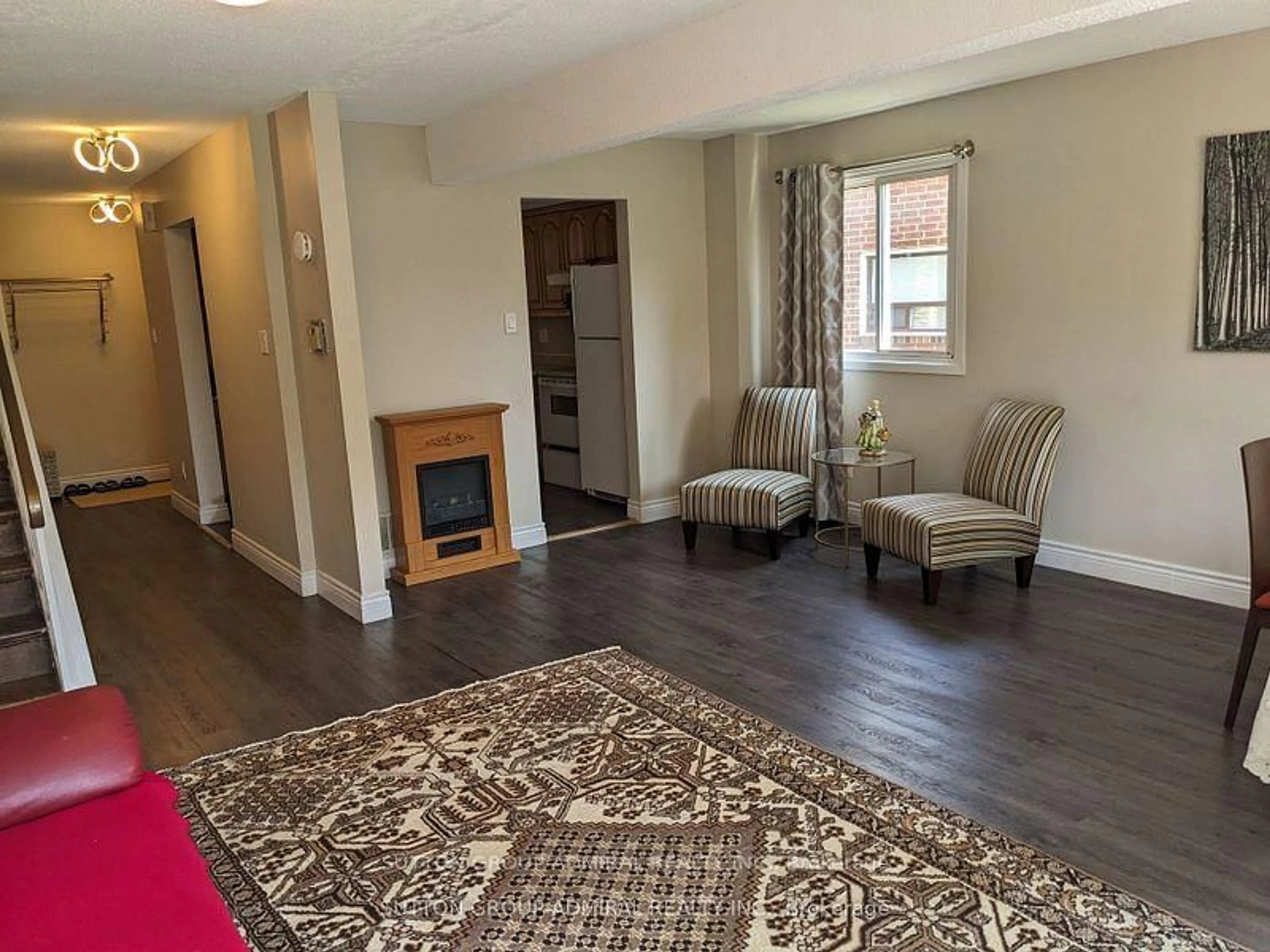 Living room with furniture, wood/laminate floor for 47 Riviera Dr, Vaughan Ontario L4K 2H9