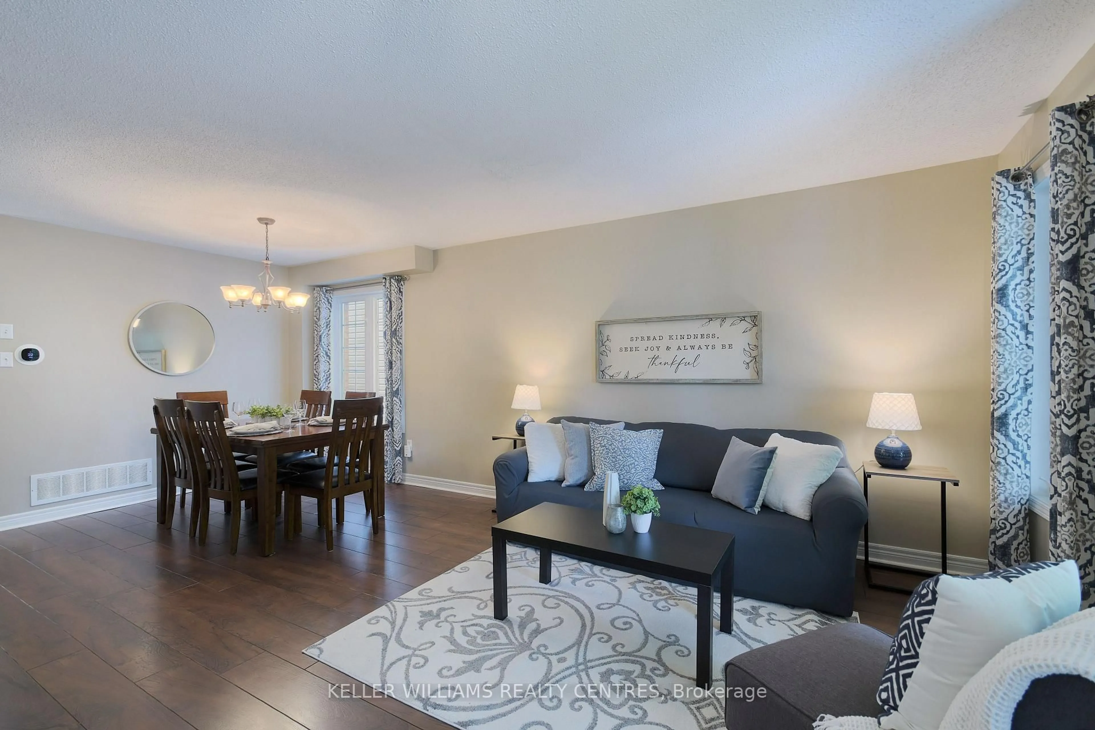 Living room with furniture, wood/laminate floor for 21 Glasgow Cres, Georgina Ontario L4P 4A9