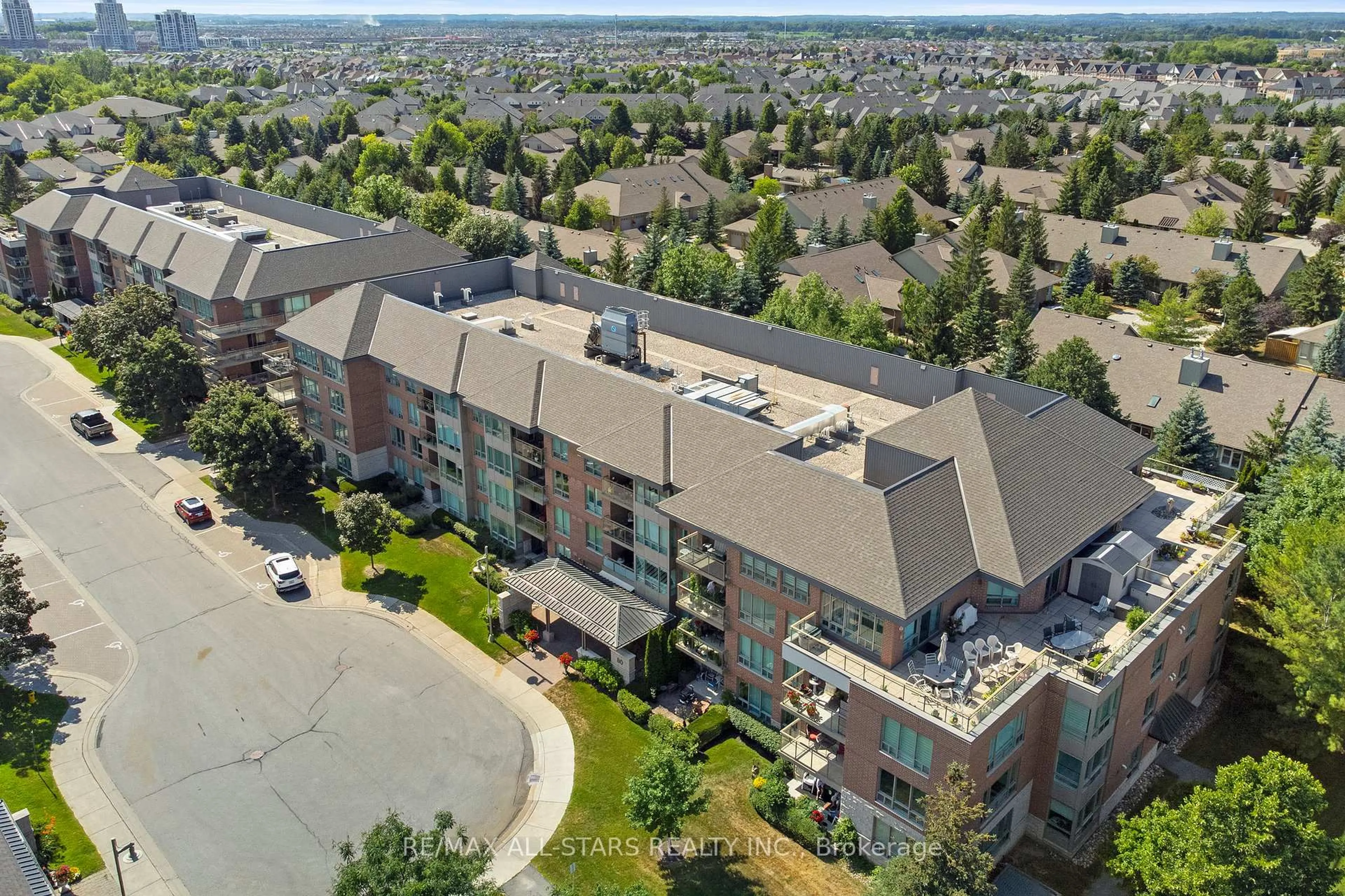 A pic from outside/outdoor area/front of a property/back of a property/a pic from drone, unknown for 80 The Boardwalk Way #319, Markham Ontario L6E 1B8