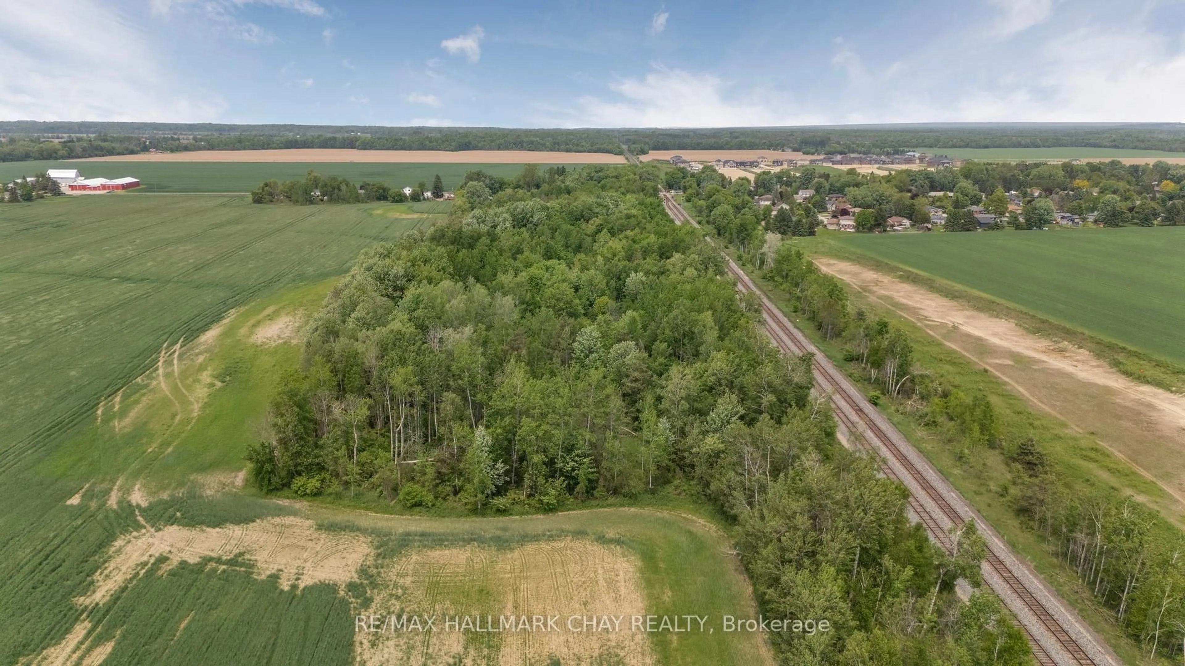 A pic from outside/outdoor area/front of a property/back of a property/a pic from drone, forest/trees view for 147 Murphy Rd, Essa Ontario L0M 1B1