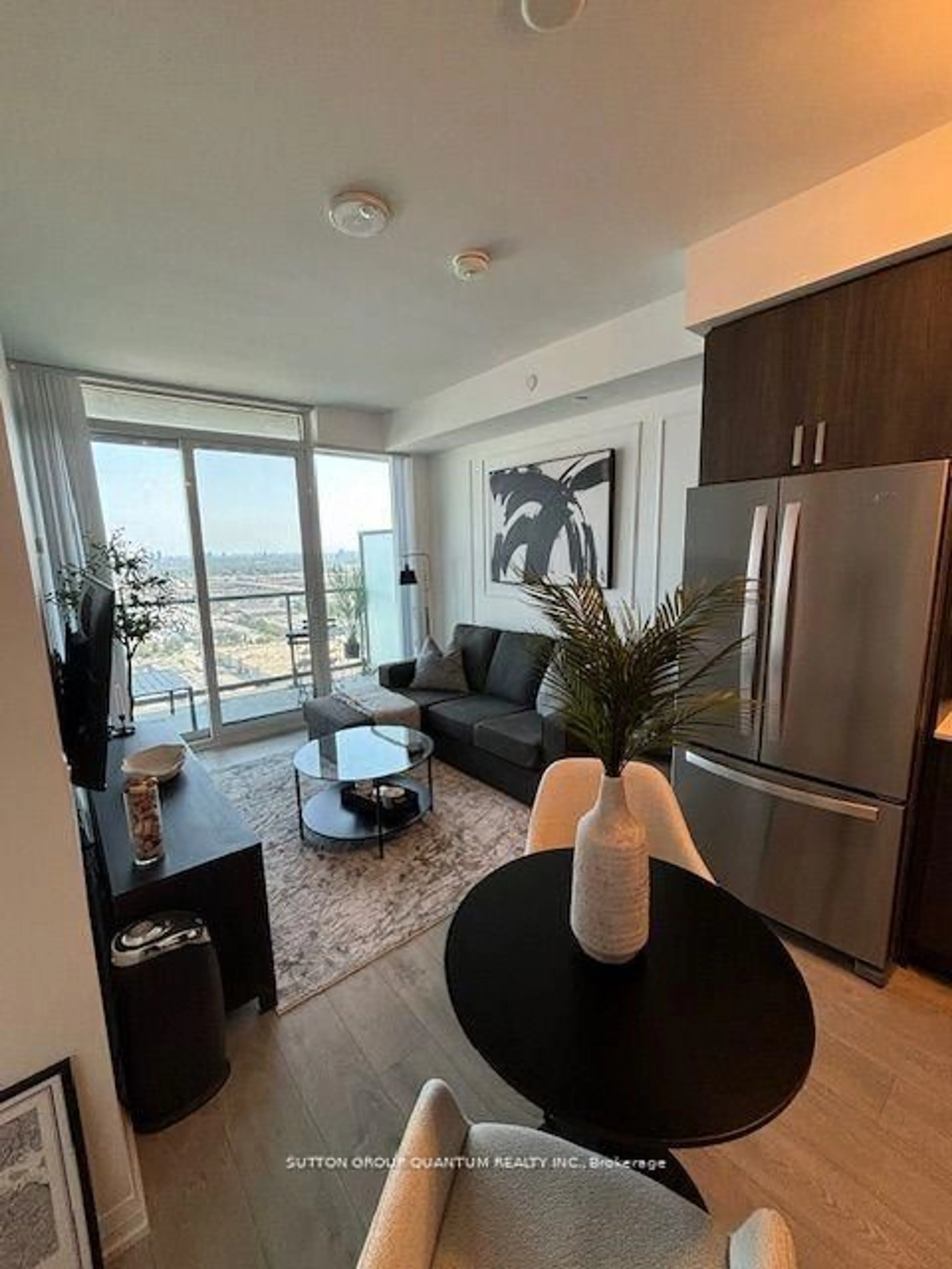 Living room with furniture, wood/laminate floor for 7895 Jane St #3116, Vaughan Ontario L4K 0K2