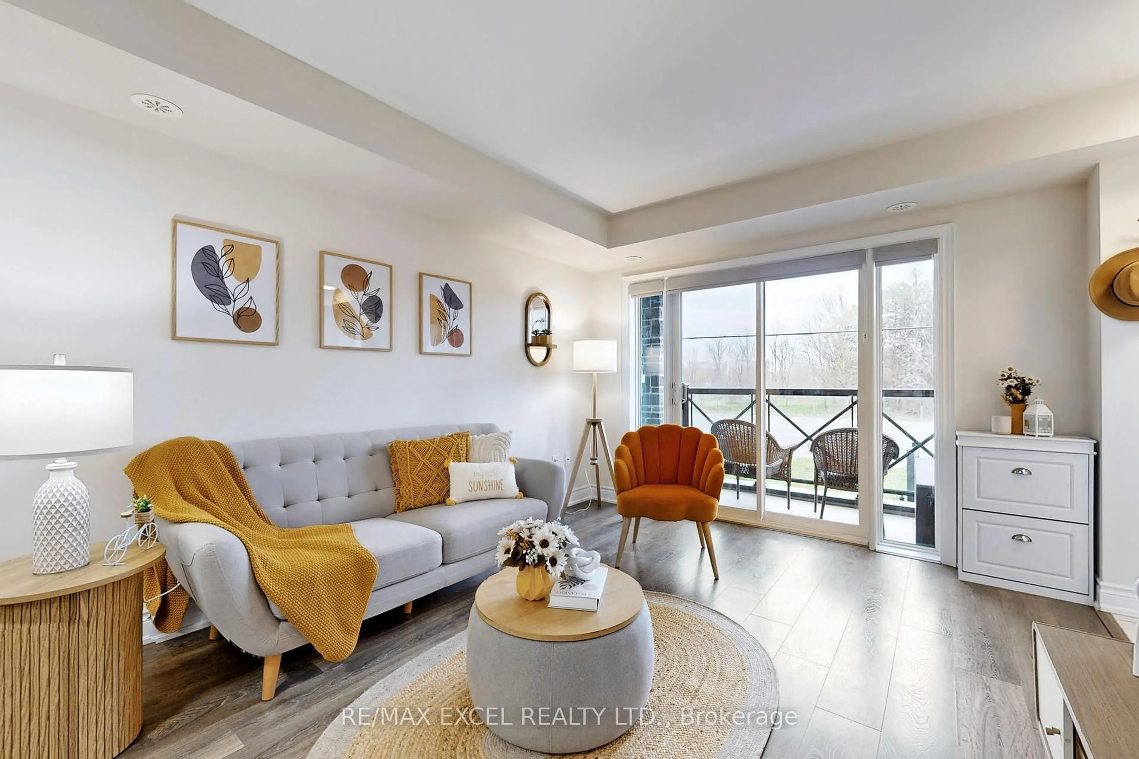 Living room with furniture, wood/laminate floor for 10 Westmeath Lane #2217, Markham Ontario L6B 1N5