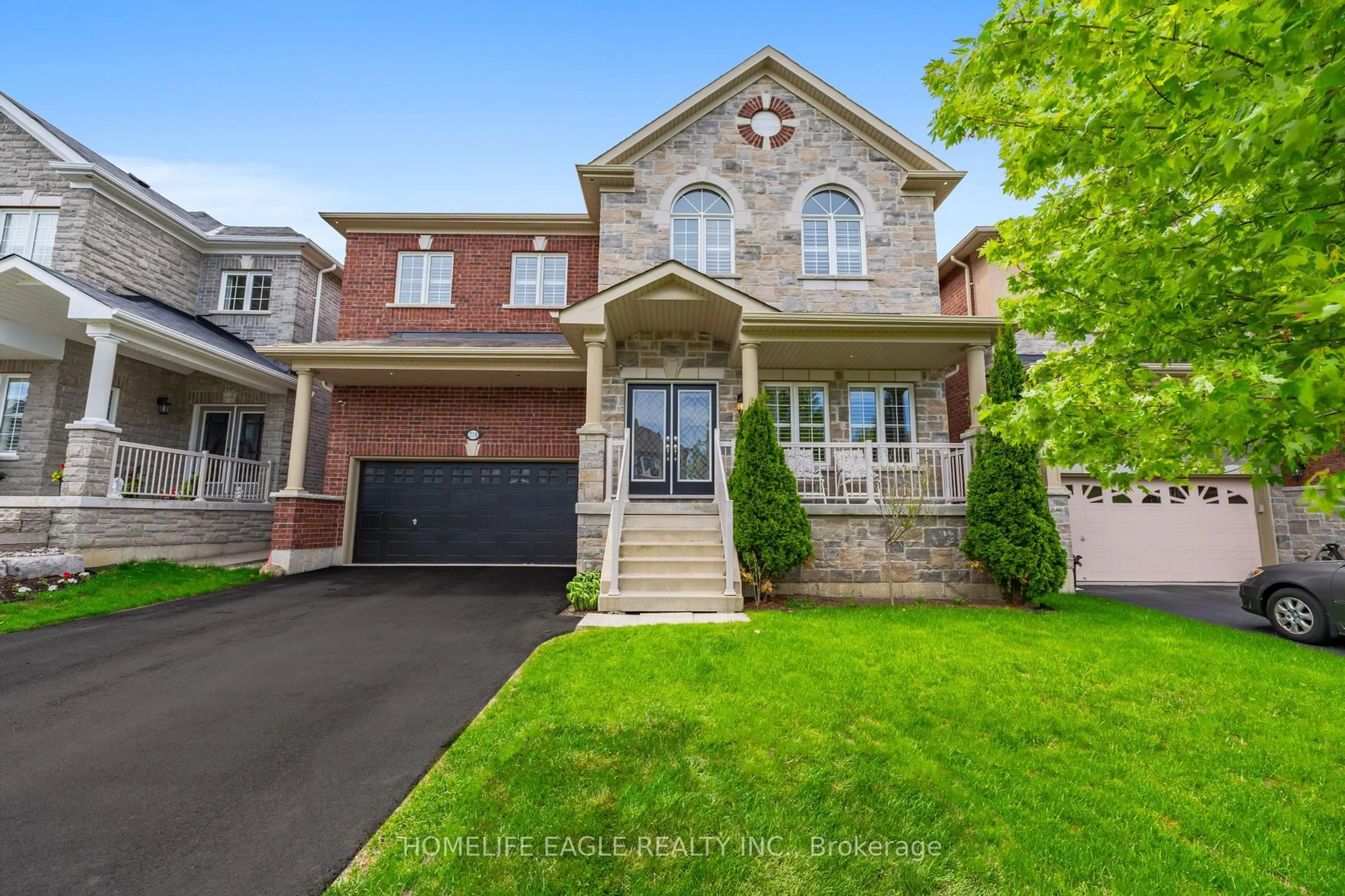 Home with brick exterior material, street for 218 Frederick Curran Lane, Newmarket Ontario L3X 3J2