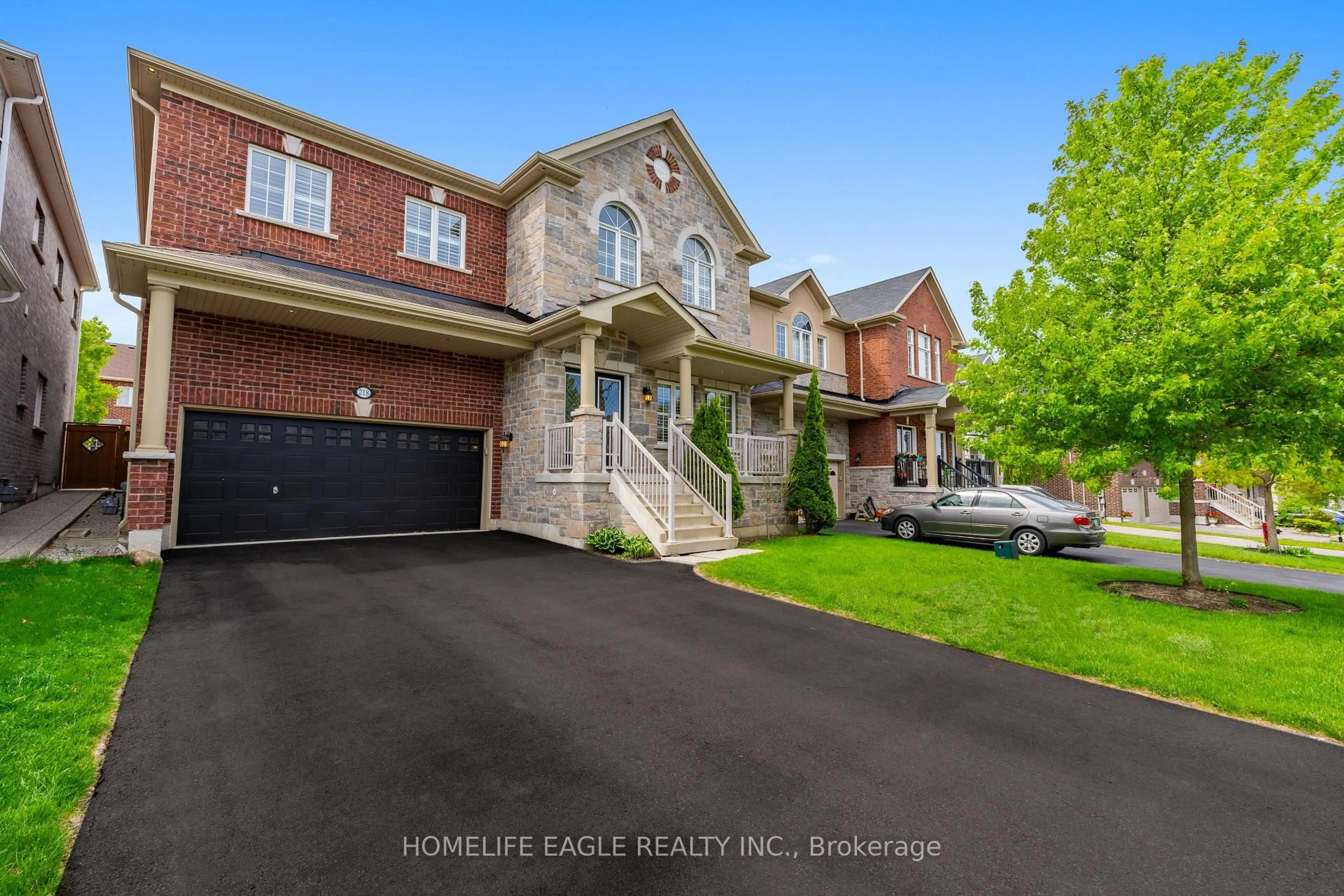 Home with brick exterior material, street for 218 Frederick Curran Lane, Newmarket Ontario L3X 3J2