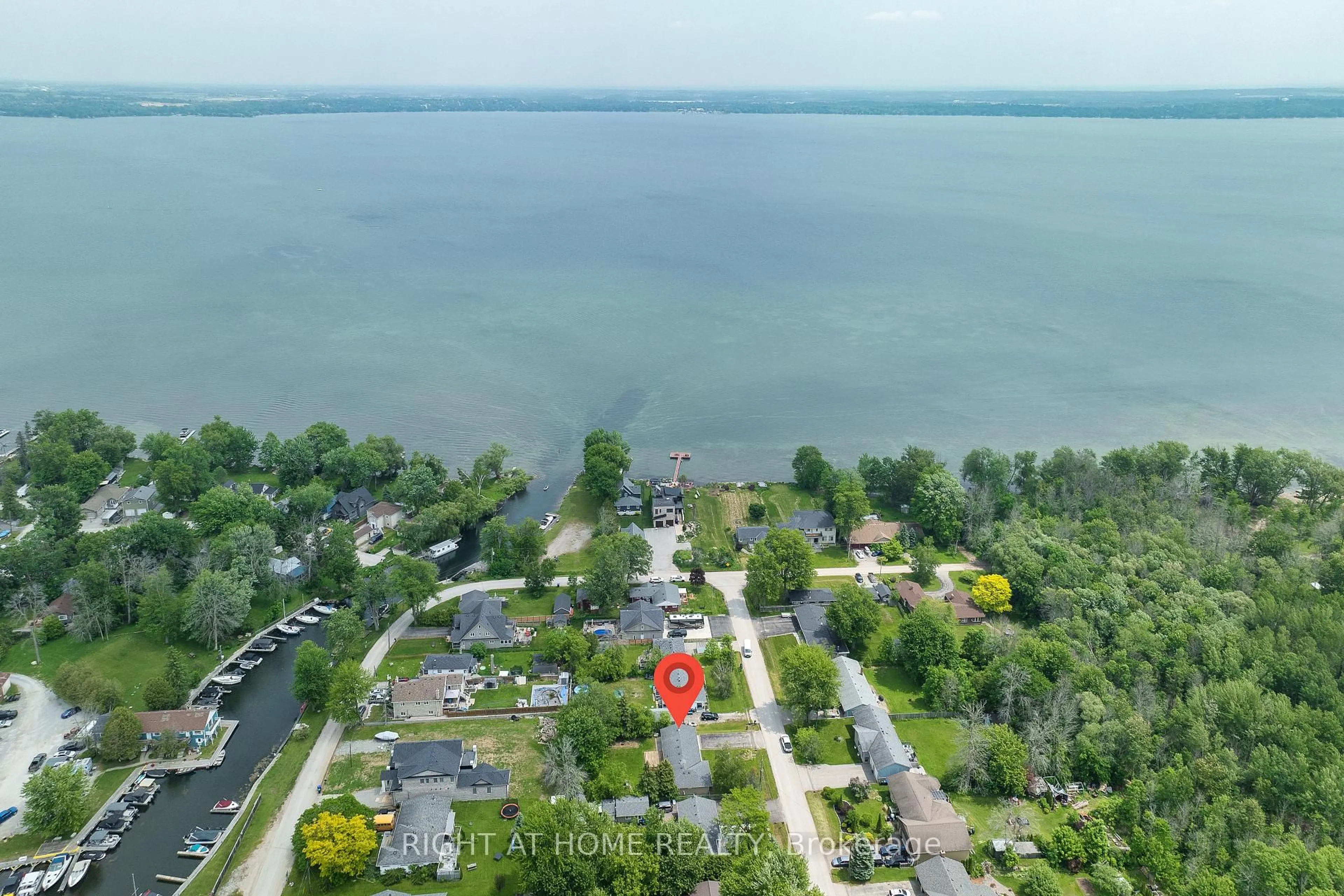 A pic from outside/outdoor area/front of a property/back of a property/a pic from drone, water/lake/river/ocean view for 1152 Birch Rd, Innisfil Ontario L0L 1R0