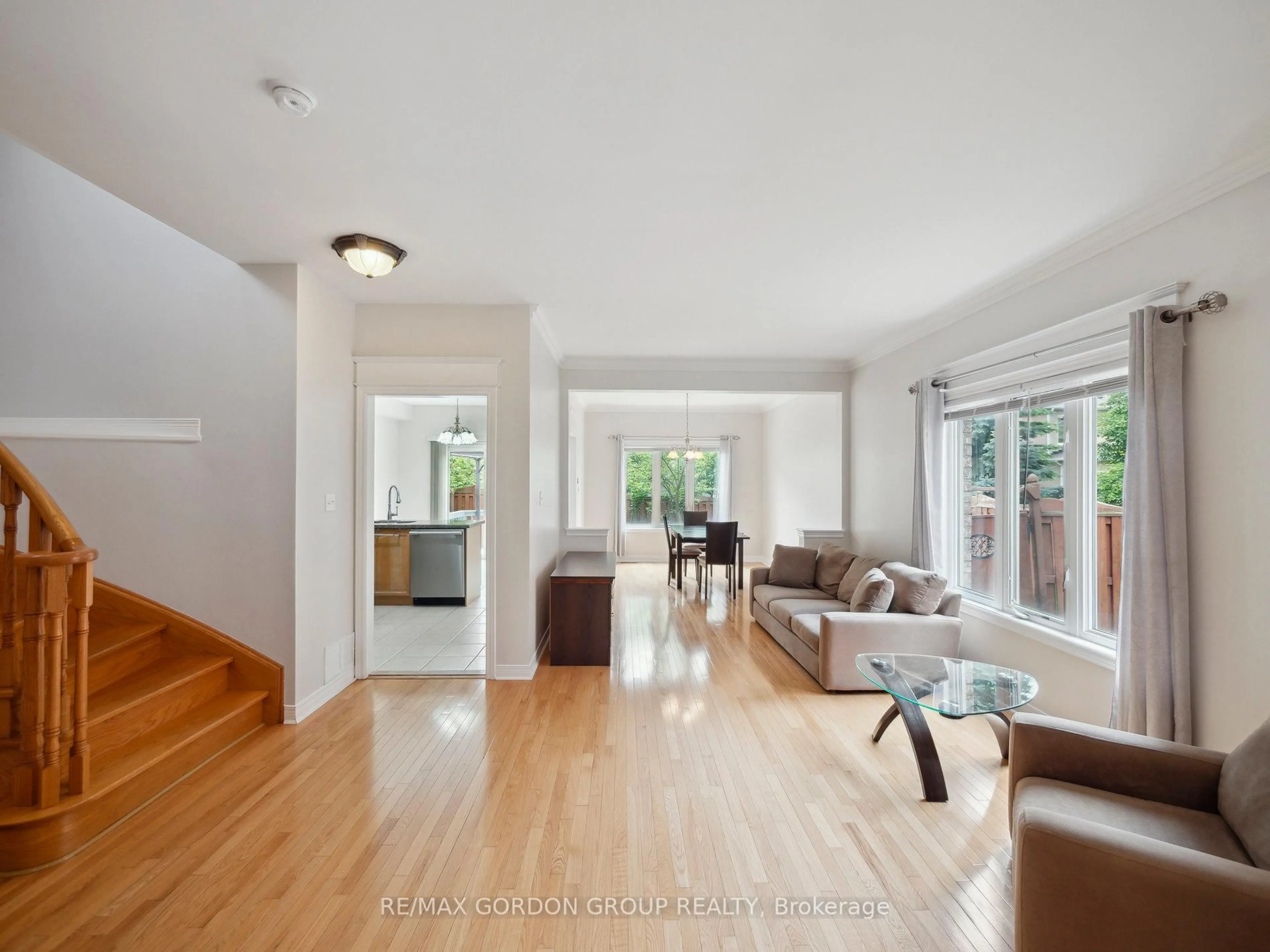 Living room with furniture, wood/laminate floor for 62 Macedonia Crt, Newmarket Ontario L3X 2W8