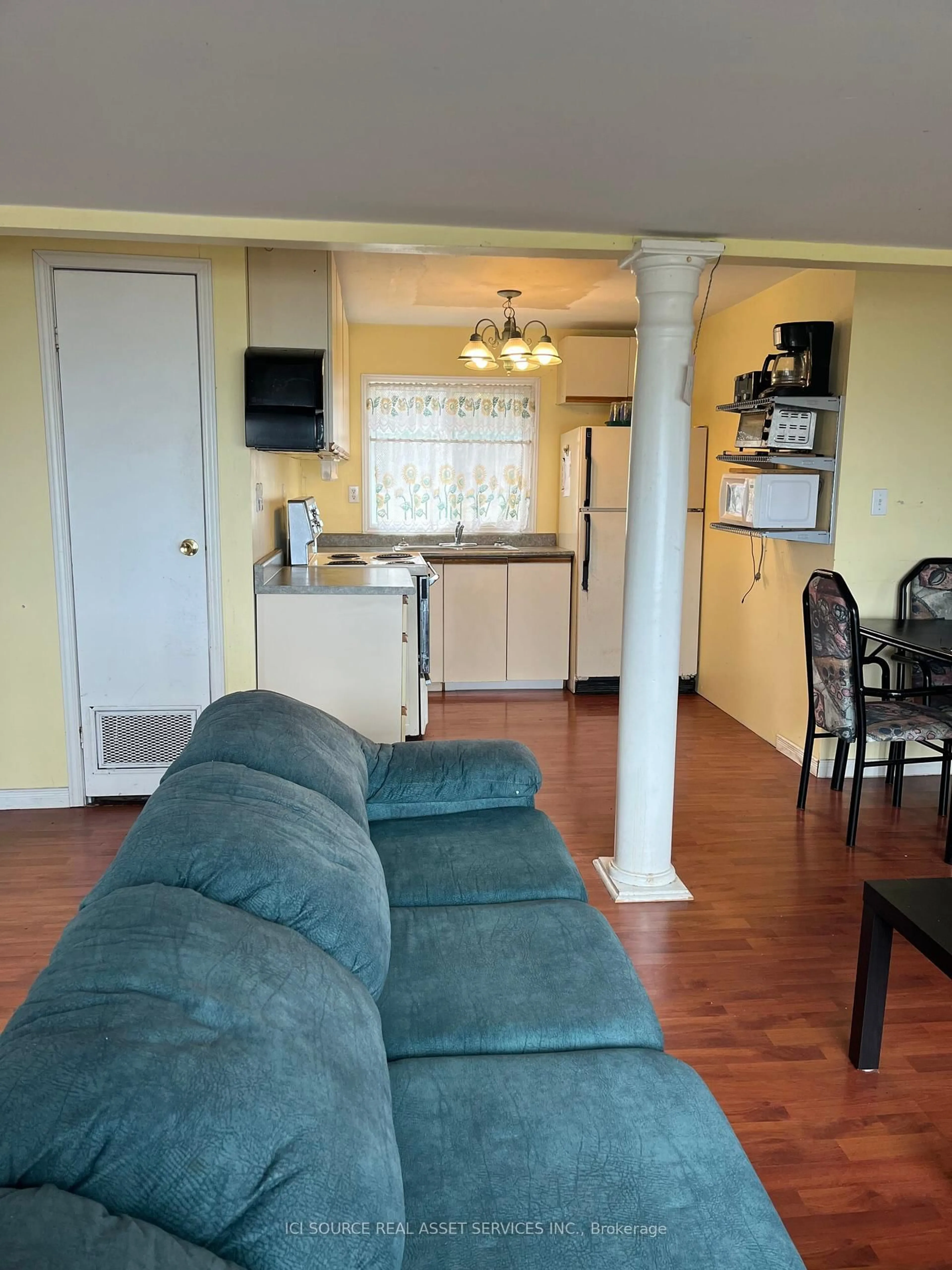 Living room with furniture, wood/laminate floor for 704 Loon Rd, Georgina Islands Ontario L0E 1R0