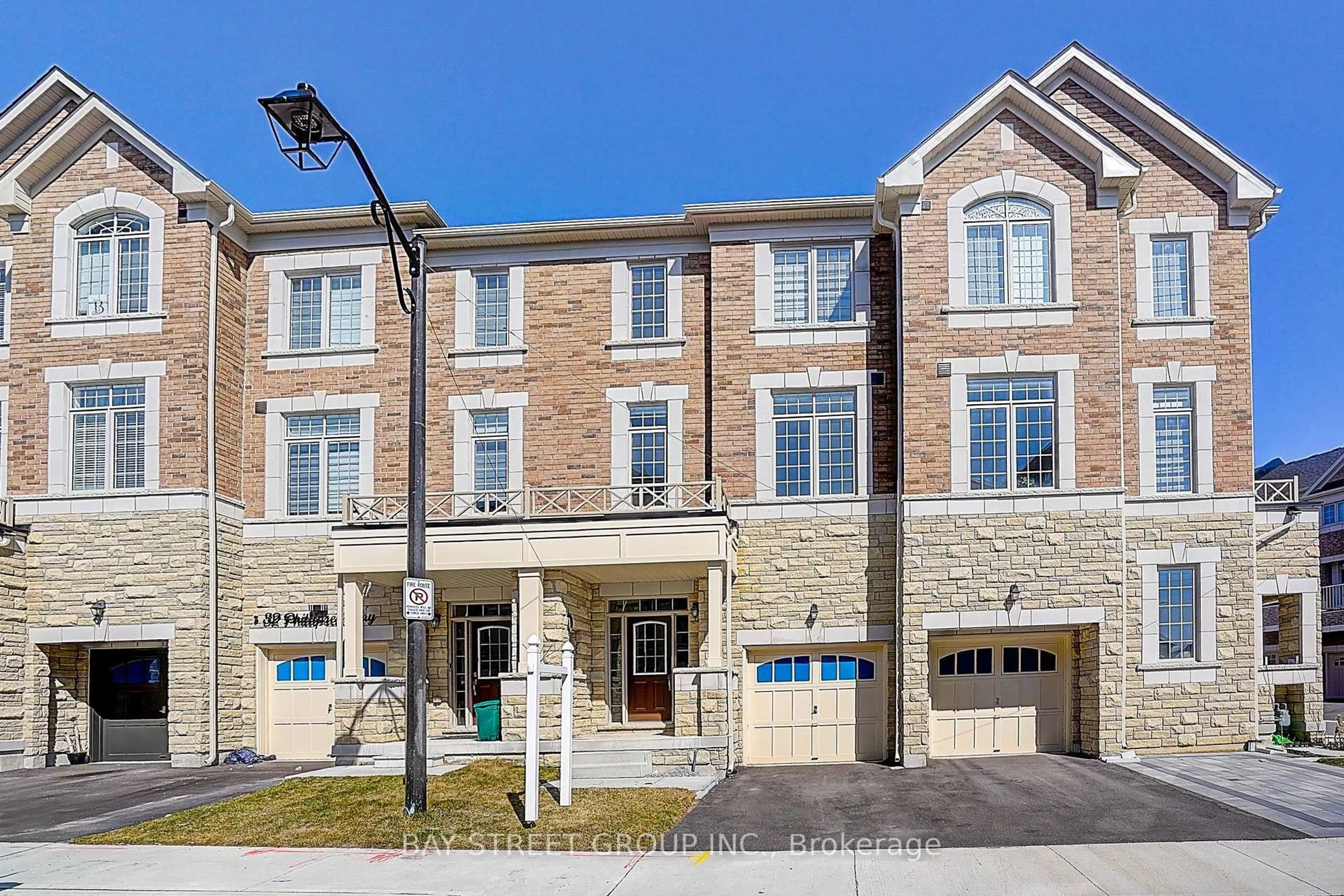 Home with brick exterior material, street for 34 Phillipsen Way, Markham Ontario L3S 0E9