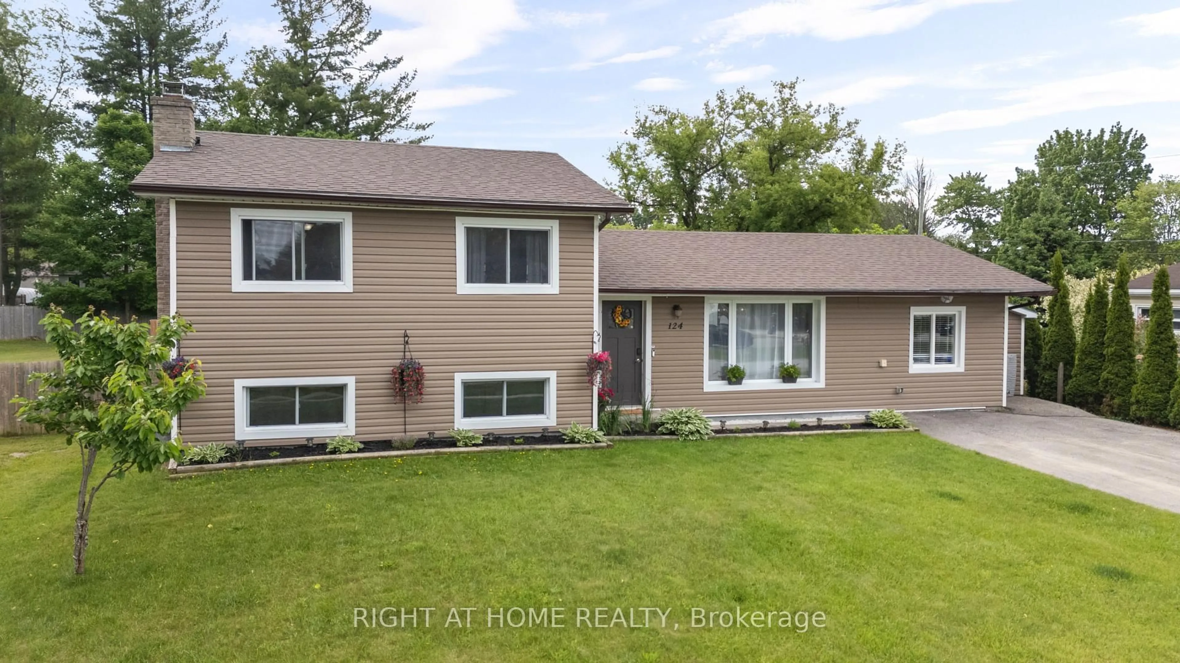 Home with vinyl exterior material, street for 124 Sydenham St, Essa Ontario L0M 1B0
