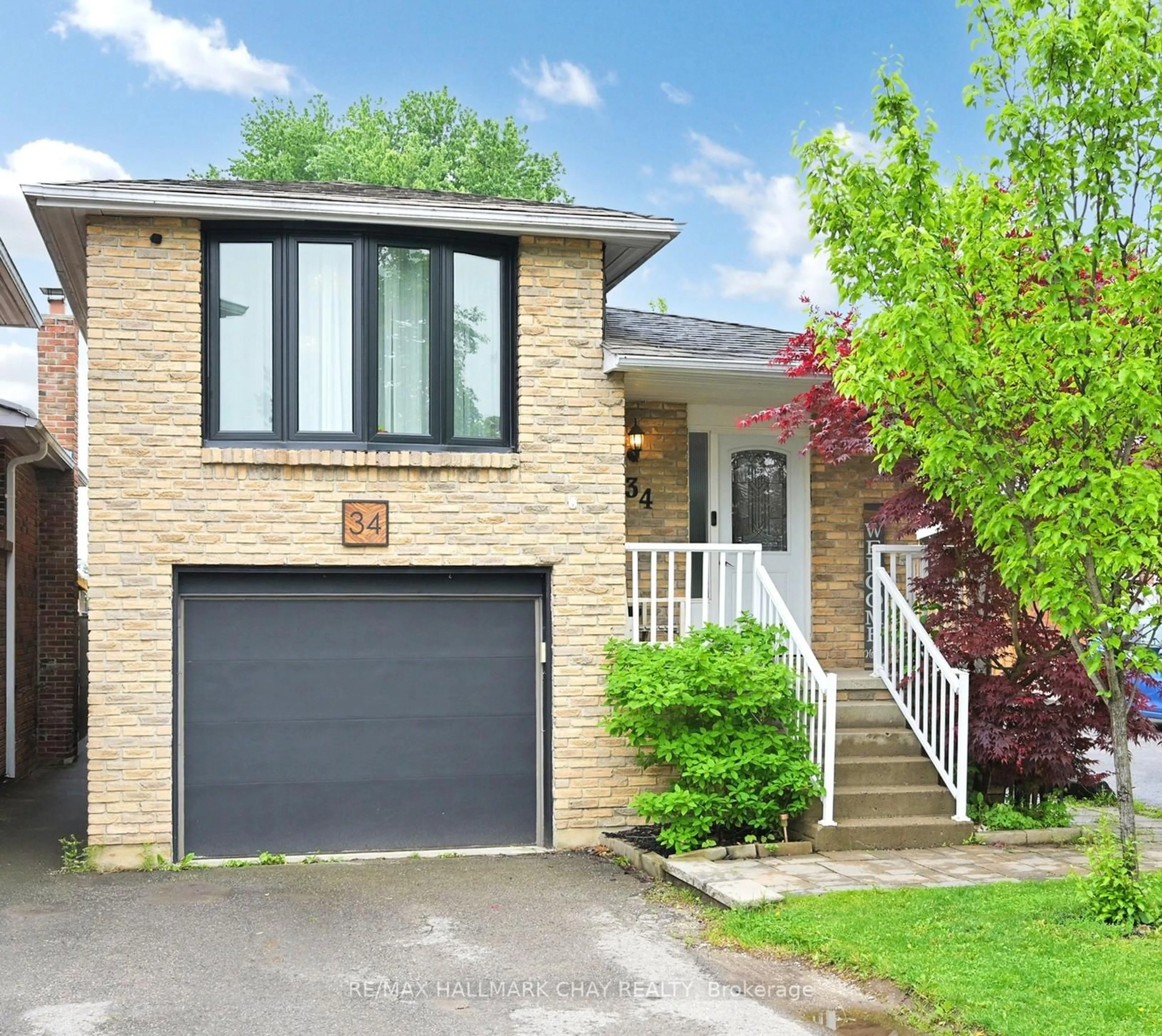 Home with brick exterior material, street for 34 Martin St, Bradford West Gwillimbury Ontario L3Z 1Z5