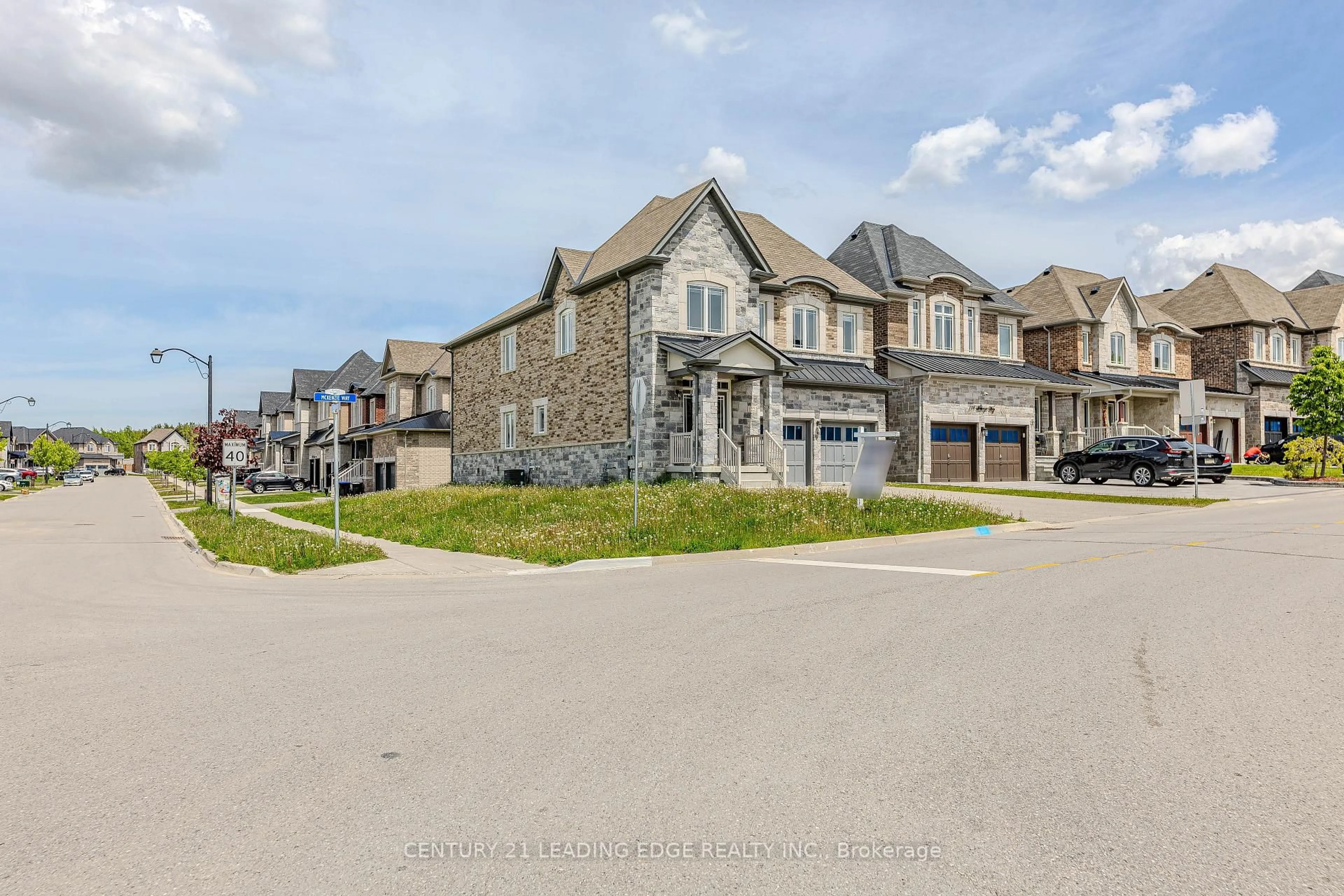 A pic from outside/outdoor area/front of a property/back of a property/a pic from drone, street for 122 Mckenzie Way, Bradford West Gwillimbury Ontario L3Z 4J4