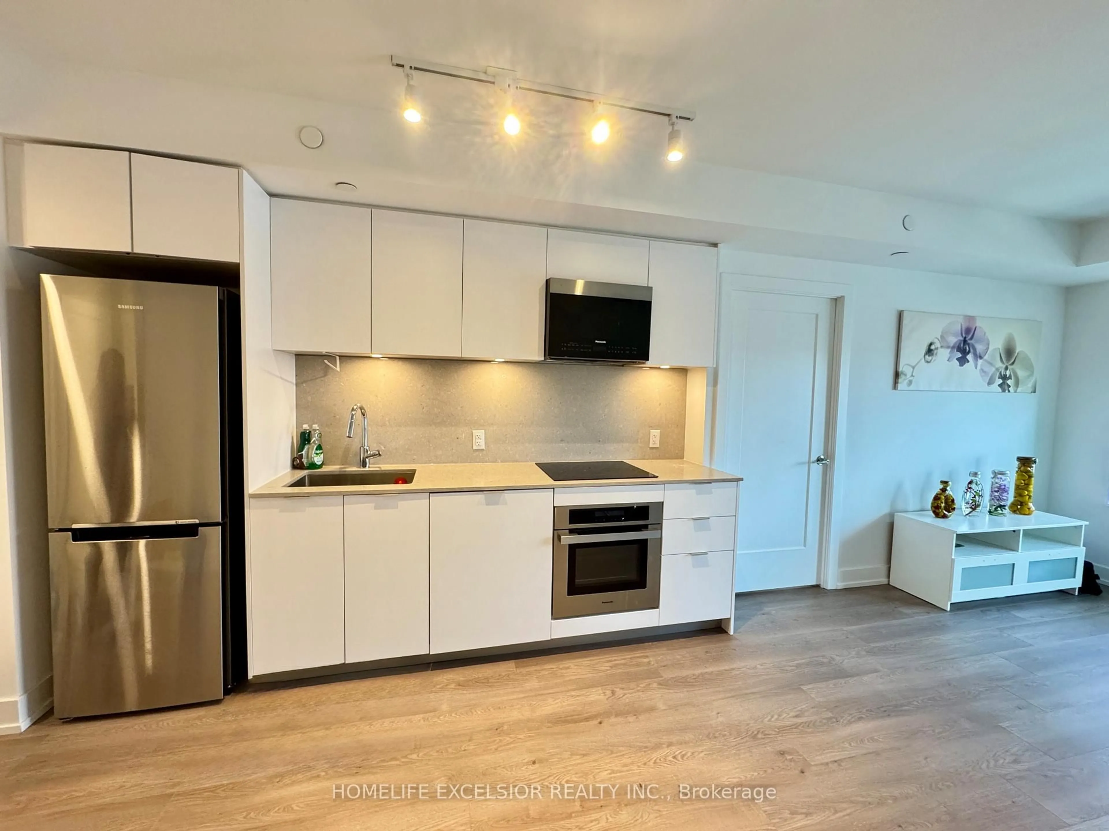 Open concept kitchen, wood/laminate floor for 9 Clegg Rd #711, Markham Ontario L6G 0B2