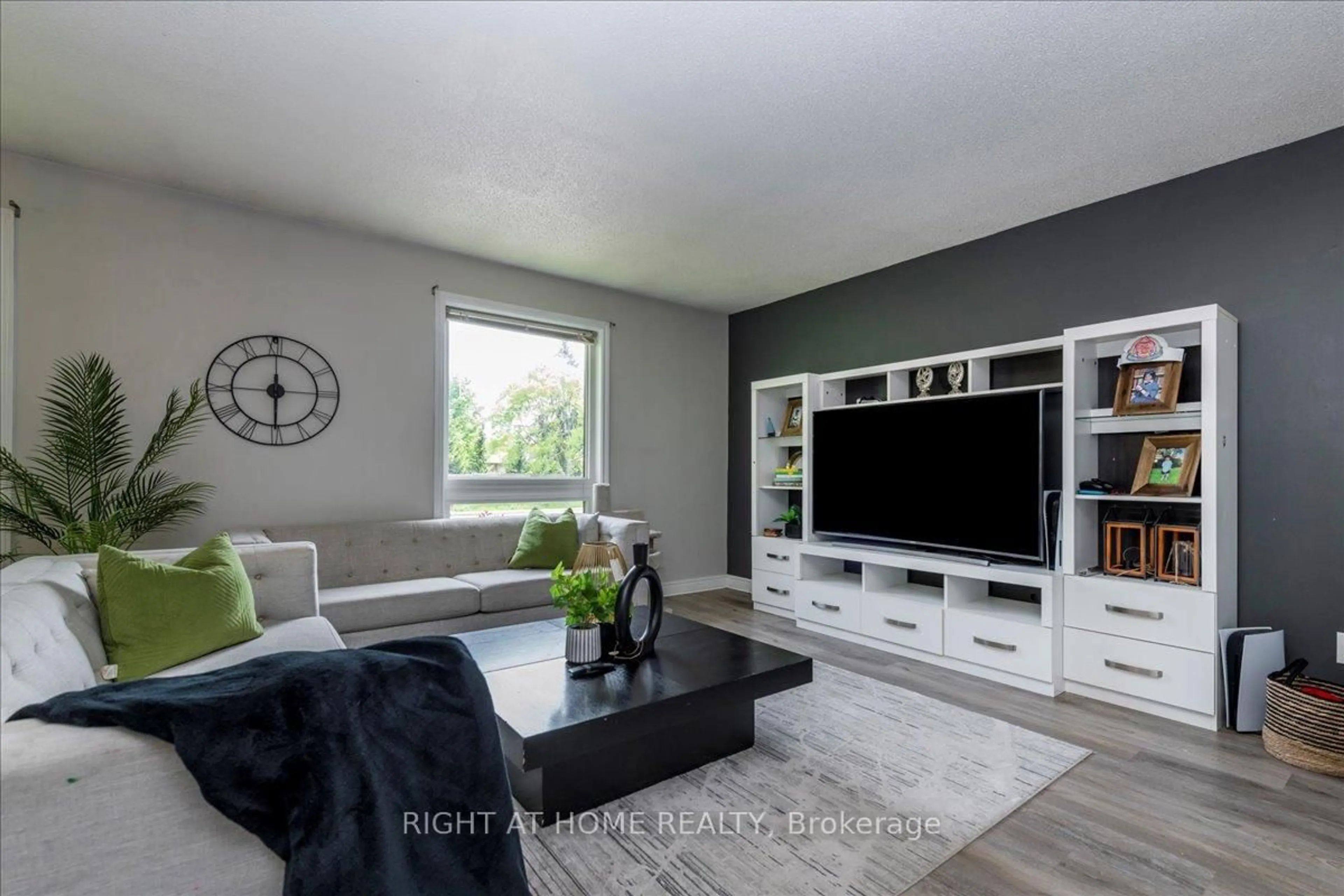Living room with furniture, wood/laminate floor for 70 metro Rd, Georgina Ontario L4P 1W1