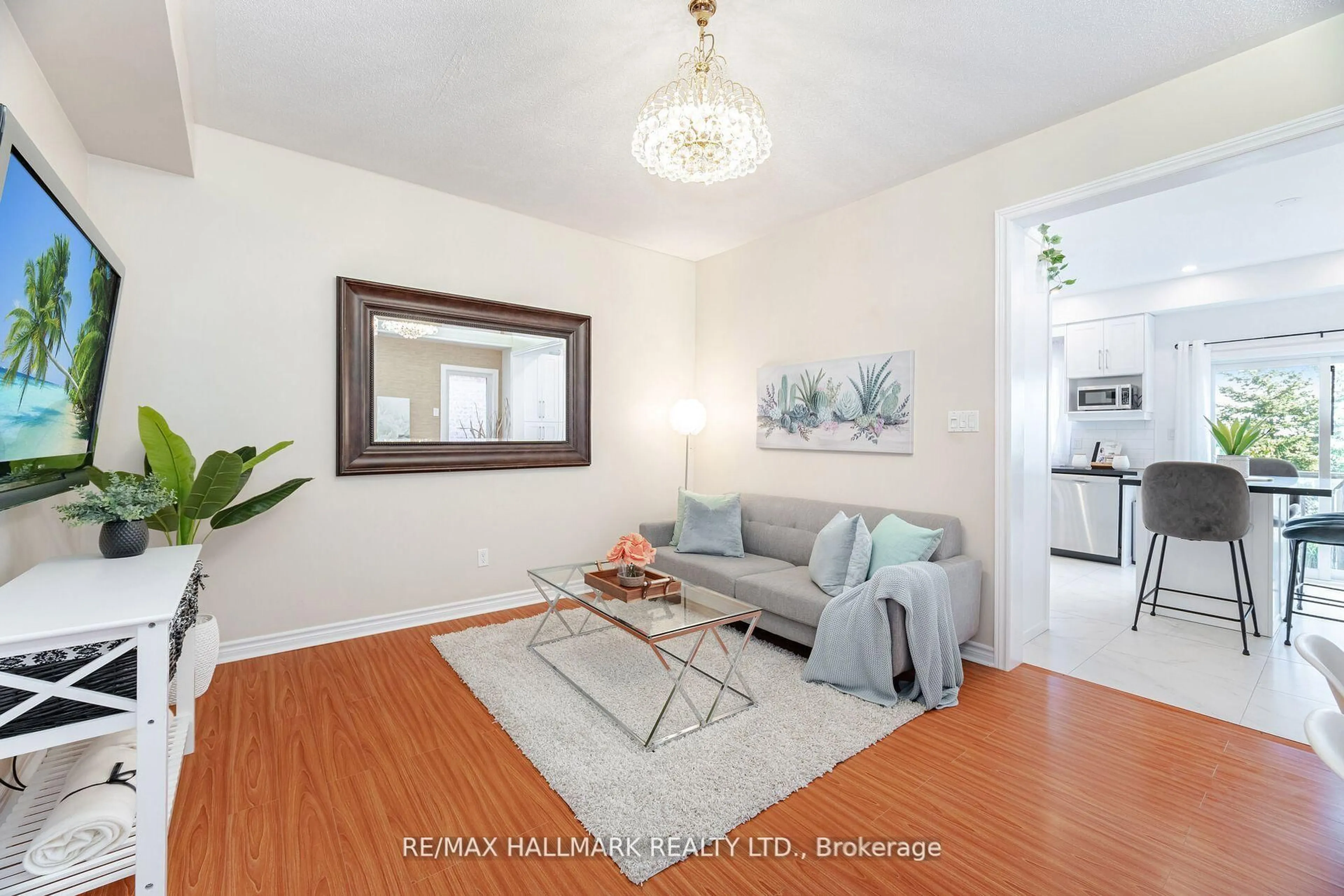 Living room with furniture, wood/laminate floor for 569 Reeves Way Blvd, Whitchurch-Stouffville Ontario L4A 0H1
