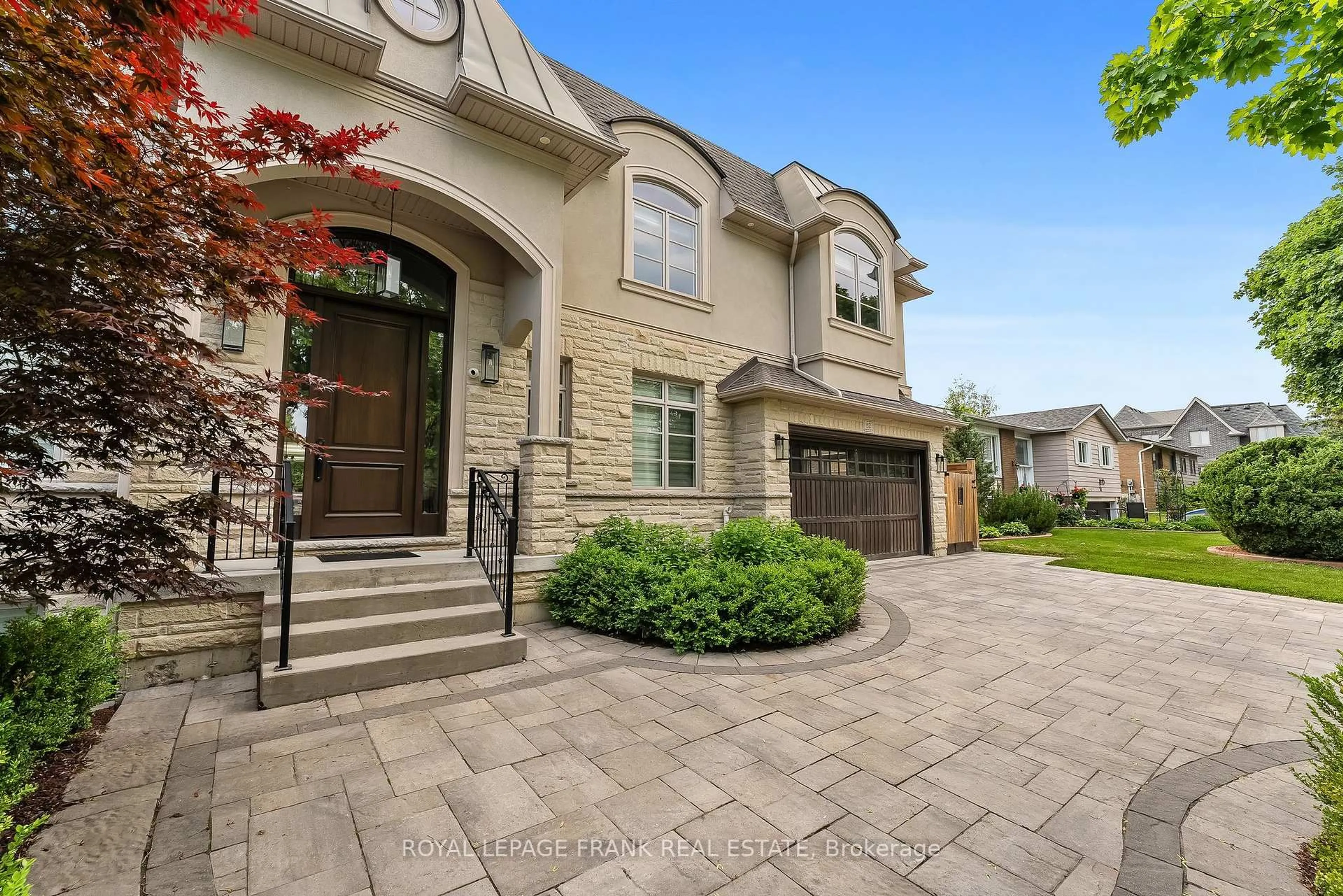 Home with brick exterior material, street for 52 Wootten Way, Markham Ontario L3P 2Y4