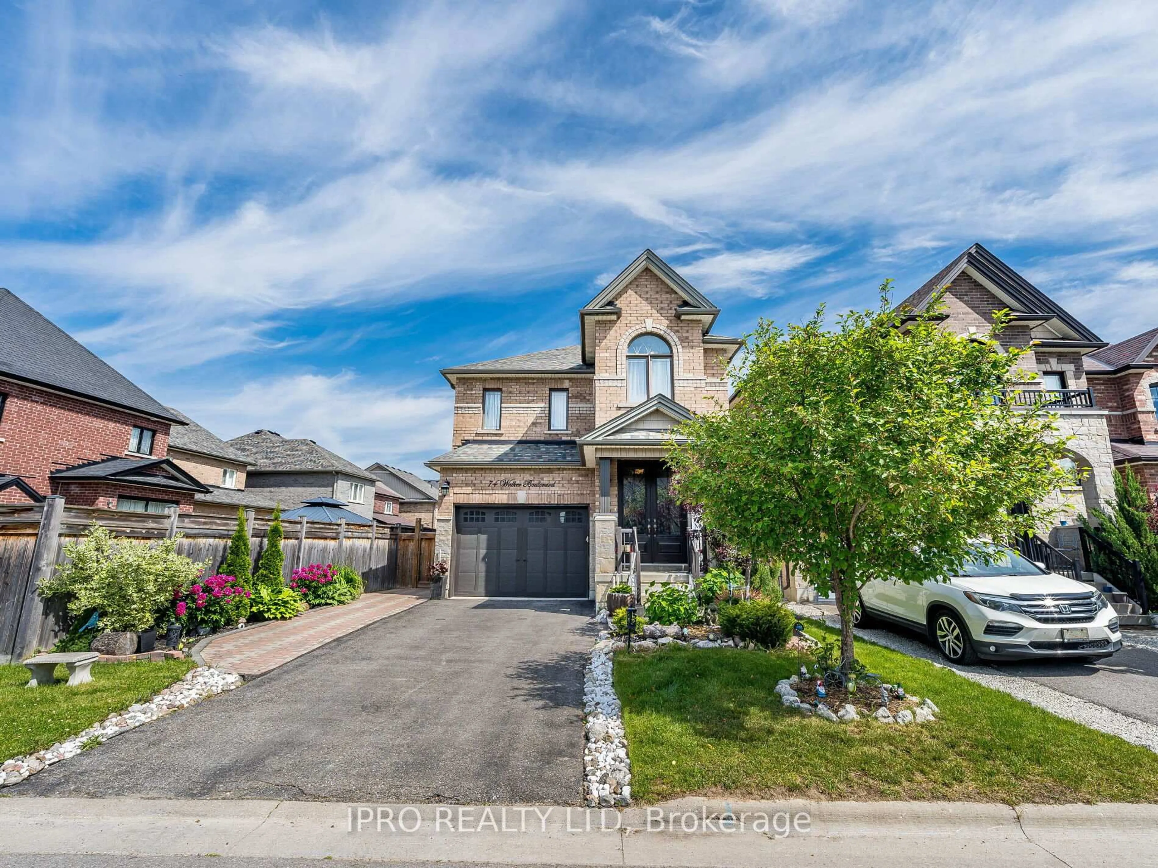 Home with brick exterior material, street for 74 Walker Blvd, New Tecumseth Ontario L9R 0N3
