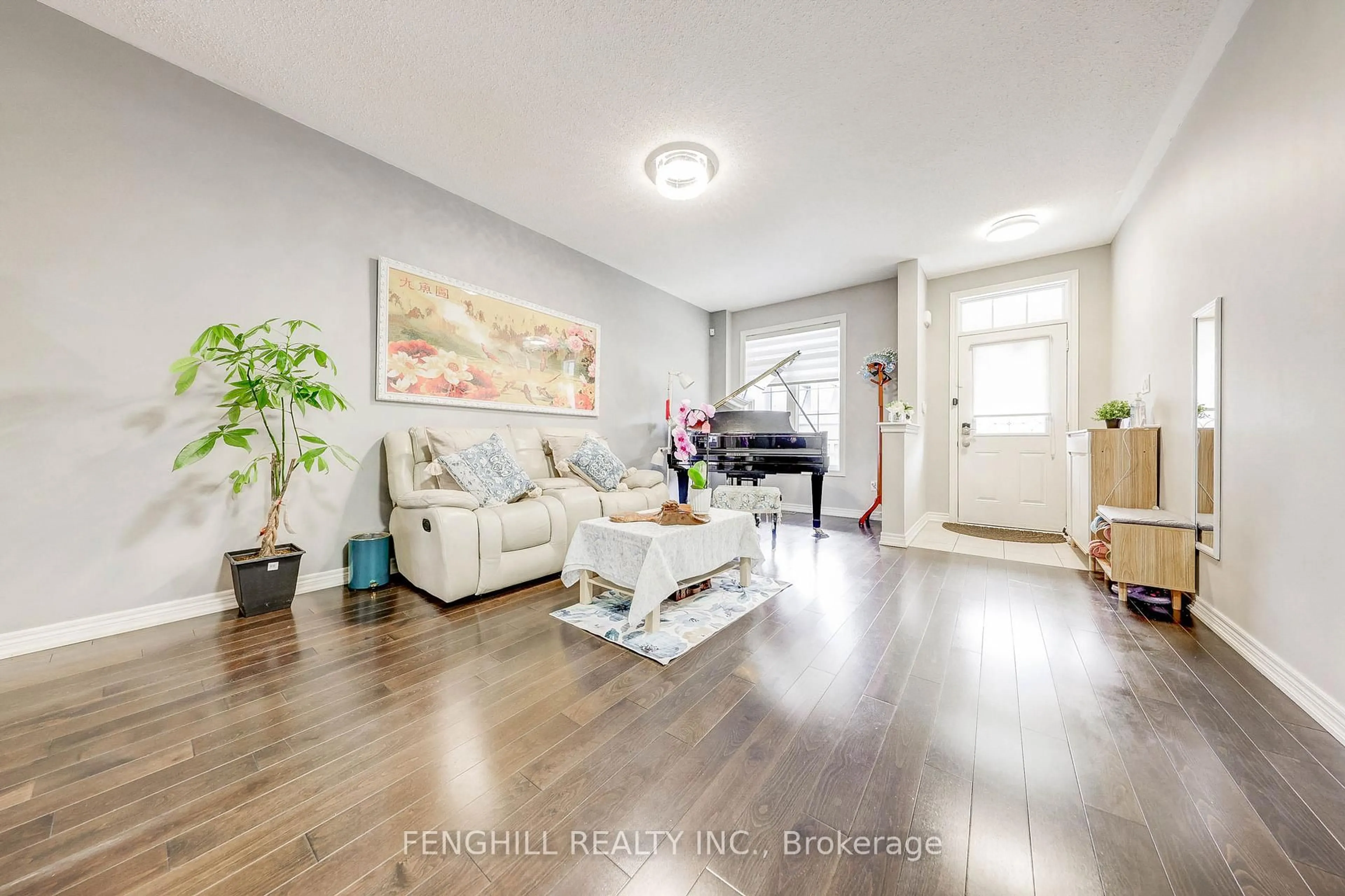 Living room with furniture, wood/laminate floor for 23 Cherna Ave, Markham Ontario L6C 0X5