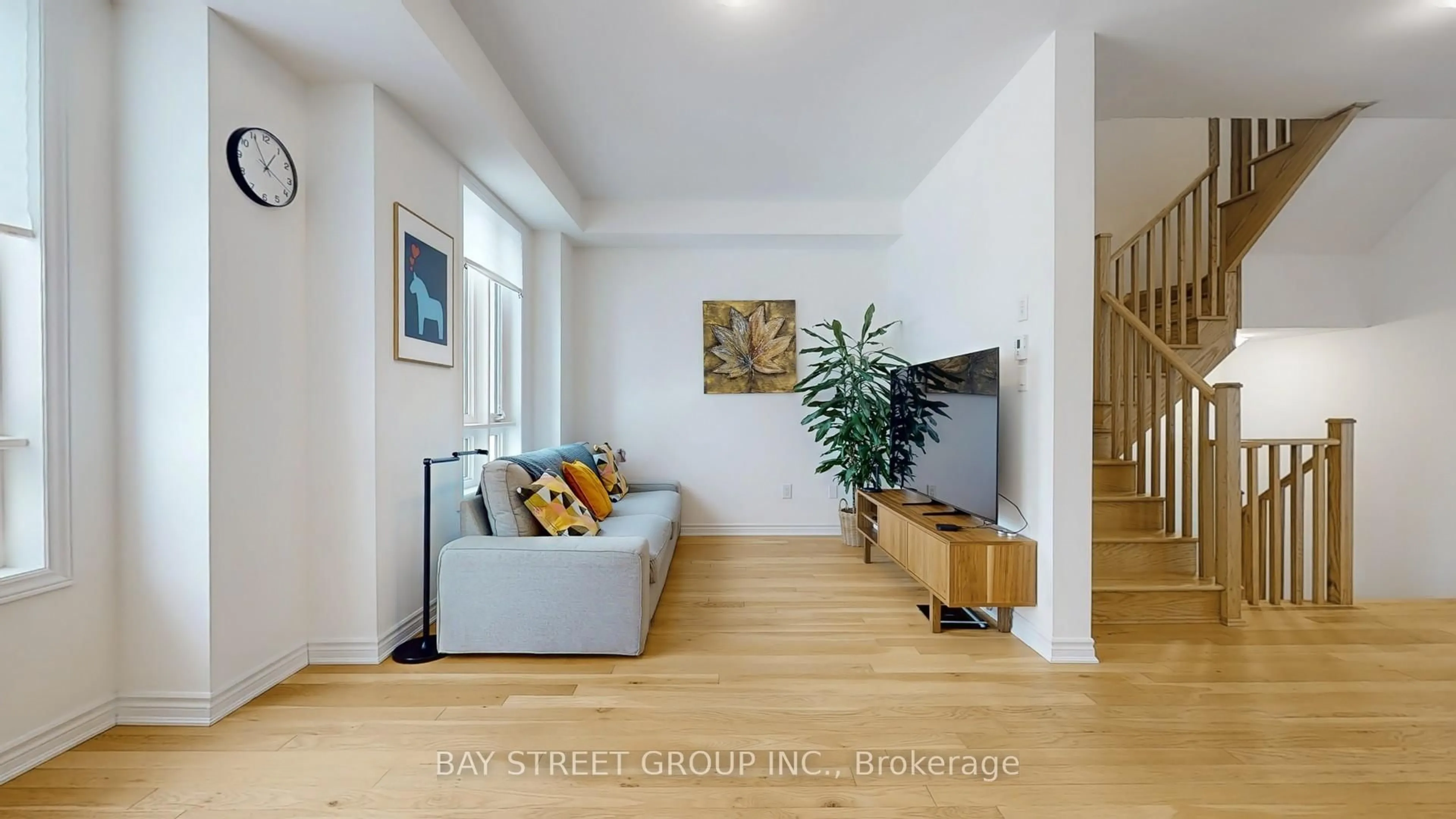 Living room with furniture, wood/laminate floor for 88 Imperial College Lane, Markham Ontario L6E 0V6