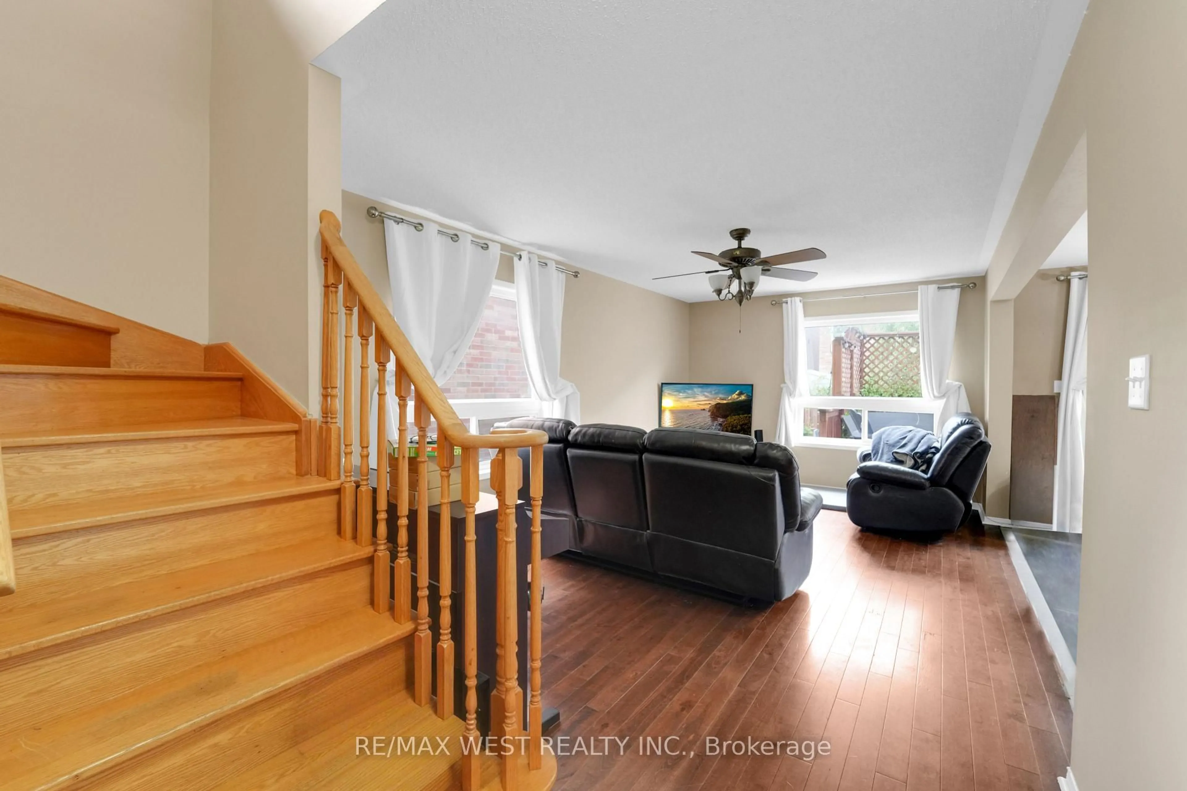 Living room with furniture, wood/laminate floor for 57 Kalinda Rd, Newmarket Ontario L3X 2Y9