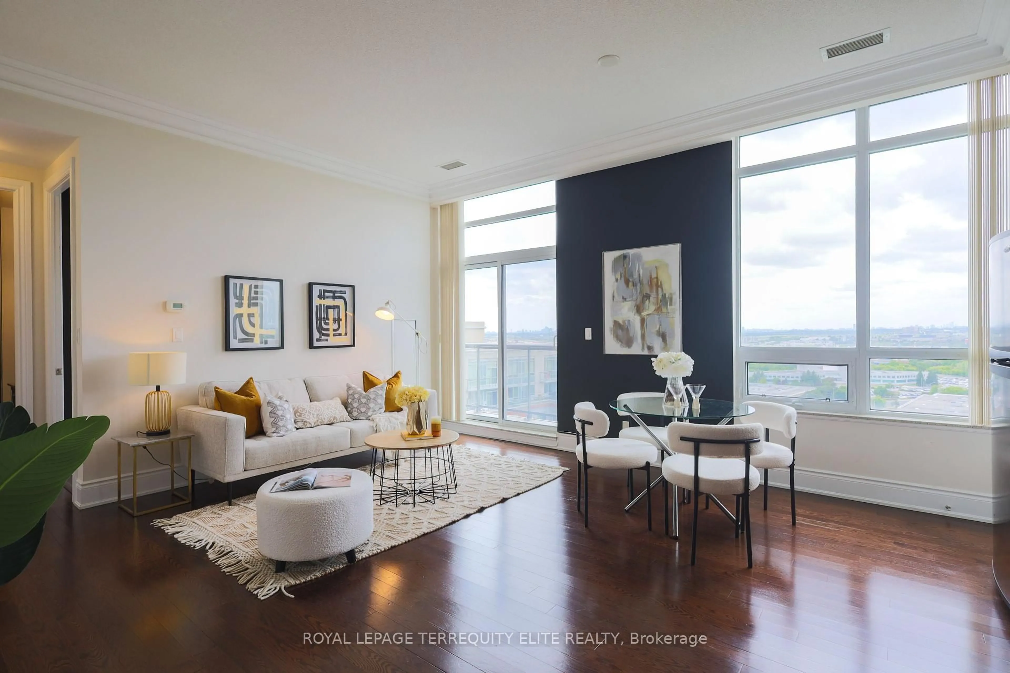 Living room with furniture, wood/laminate floor for 60 South Town Centre Blvd #UPH1, Markham Ontario L6G 0C5