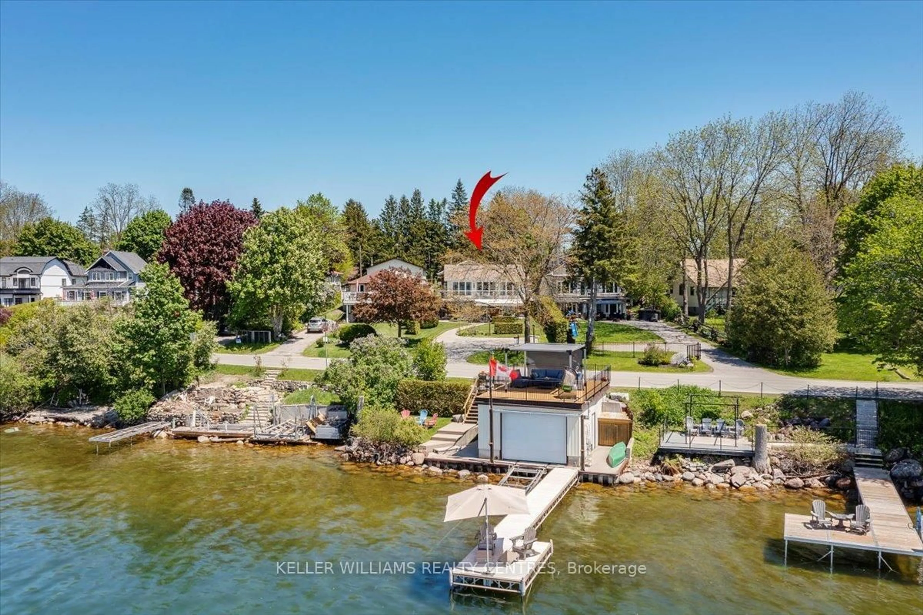 A pic from outside/outdoor area/front of a property/back of a property/a pic from drone, water/lake/river/ocean view for 137 Lake Dr, Georgina Ontario L4P 3C8