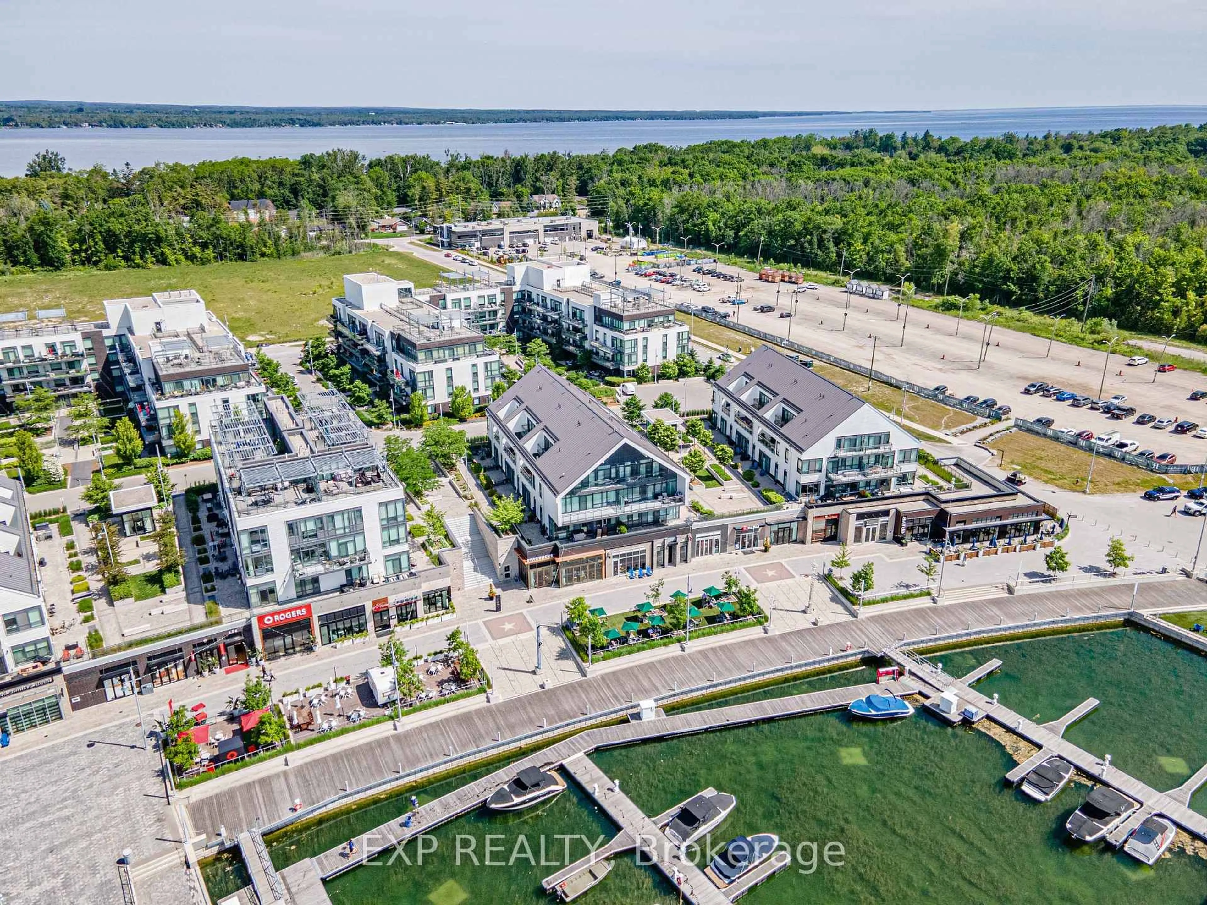 A pic from outside/outdoor area/front of a property/back of a property/a pic from drone, water/lake/river/ocean view for 247 Broward Way #31, Innisfil Ontario L9S 0M1