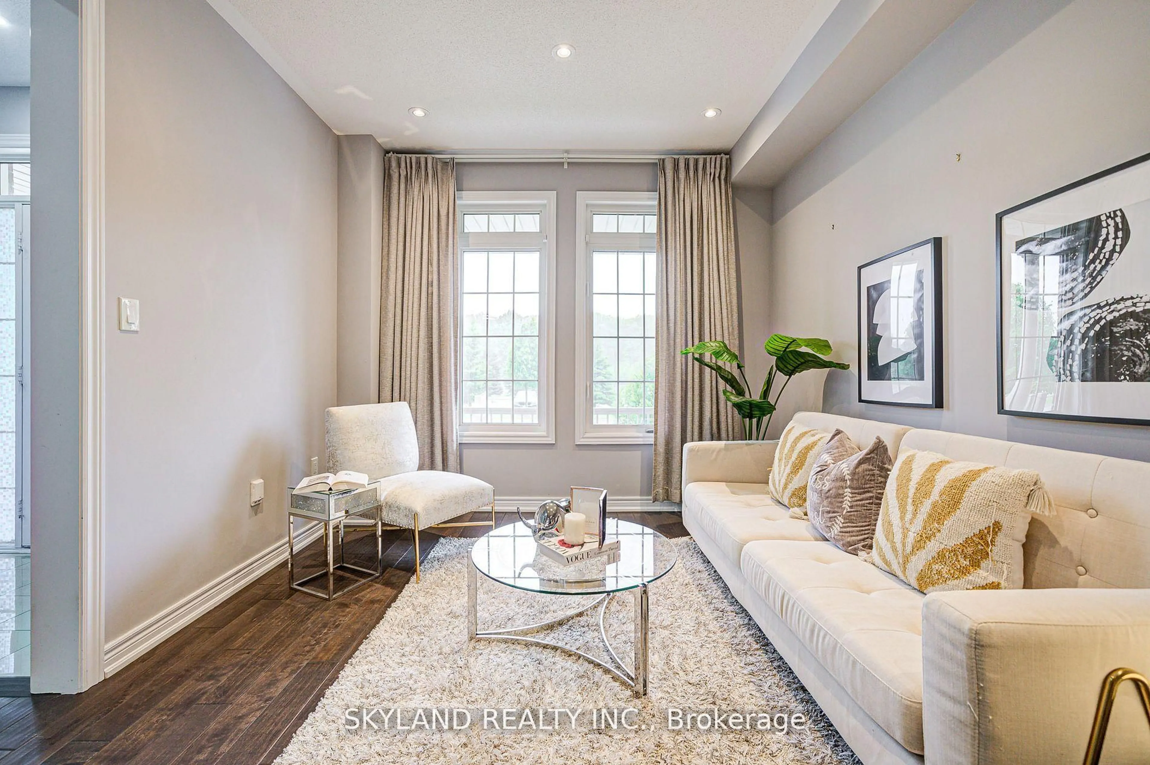 Living room with furniture, wood/laminate floor for 932 Castlemore Ave, Markham Ontario L6E 0N3