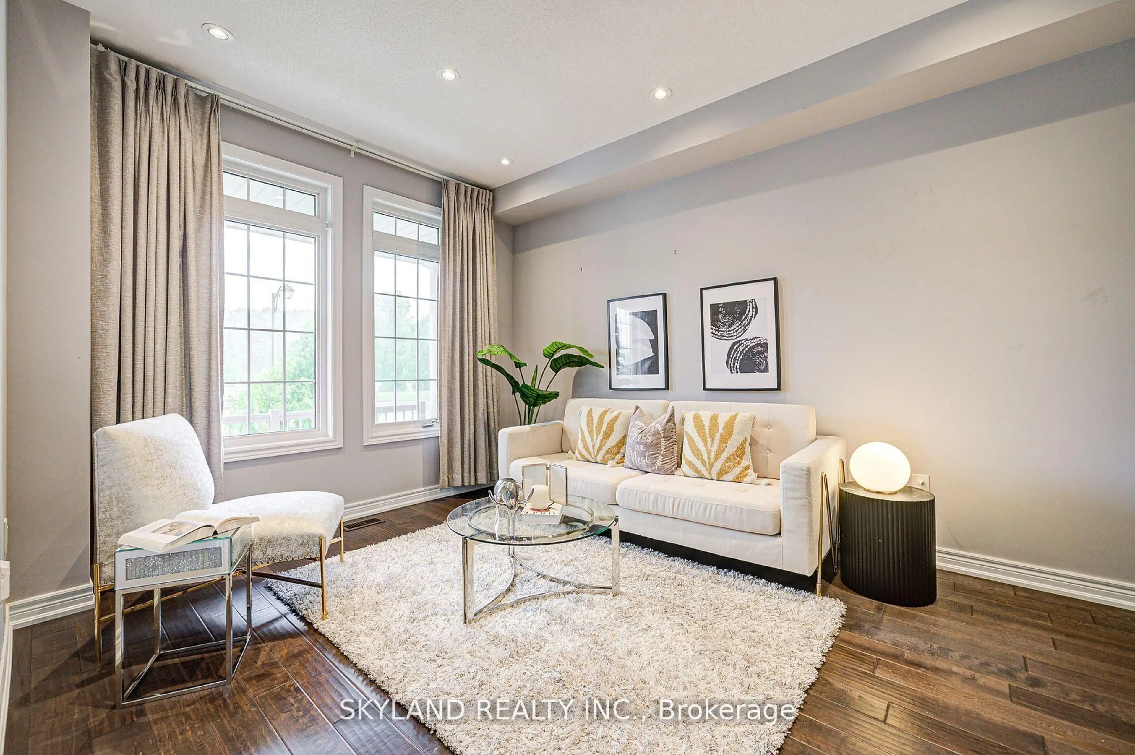Living room with furniture, wood/laminate floor for 932 Castlemore Ave, Markham Ontario L6E 0N3