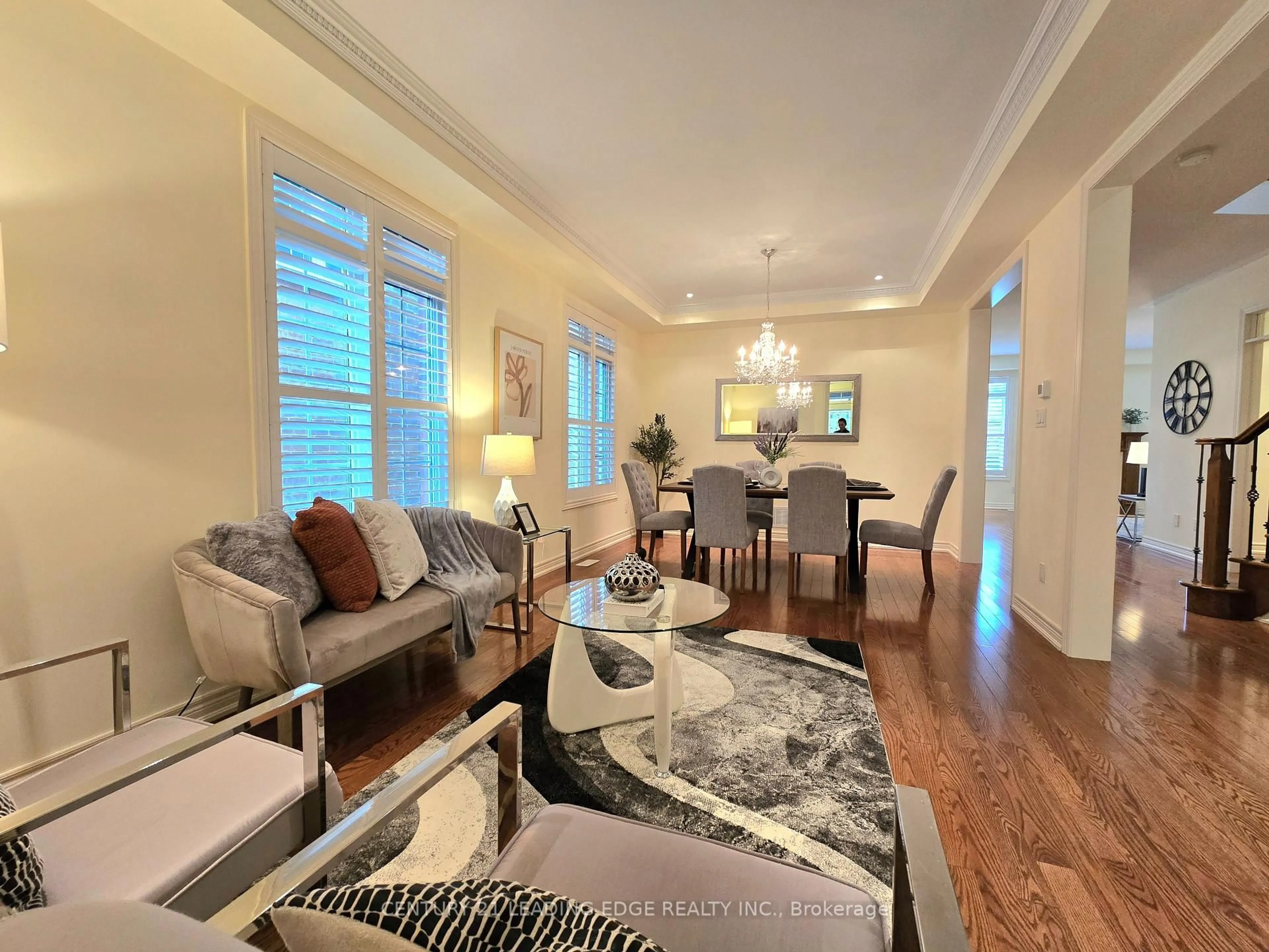 Living room with furniture, wood/laminate floor for 6 Castleglen Blvd, Markham Ontario L6C 0A8