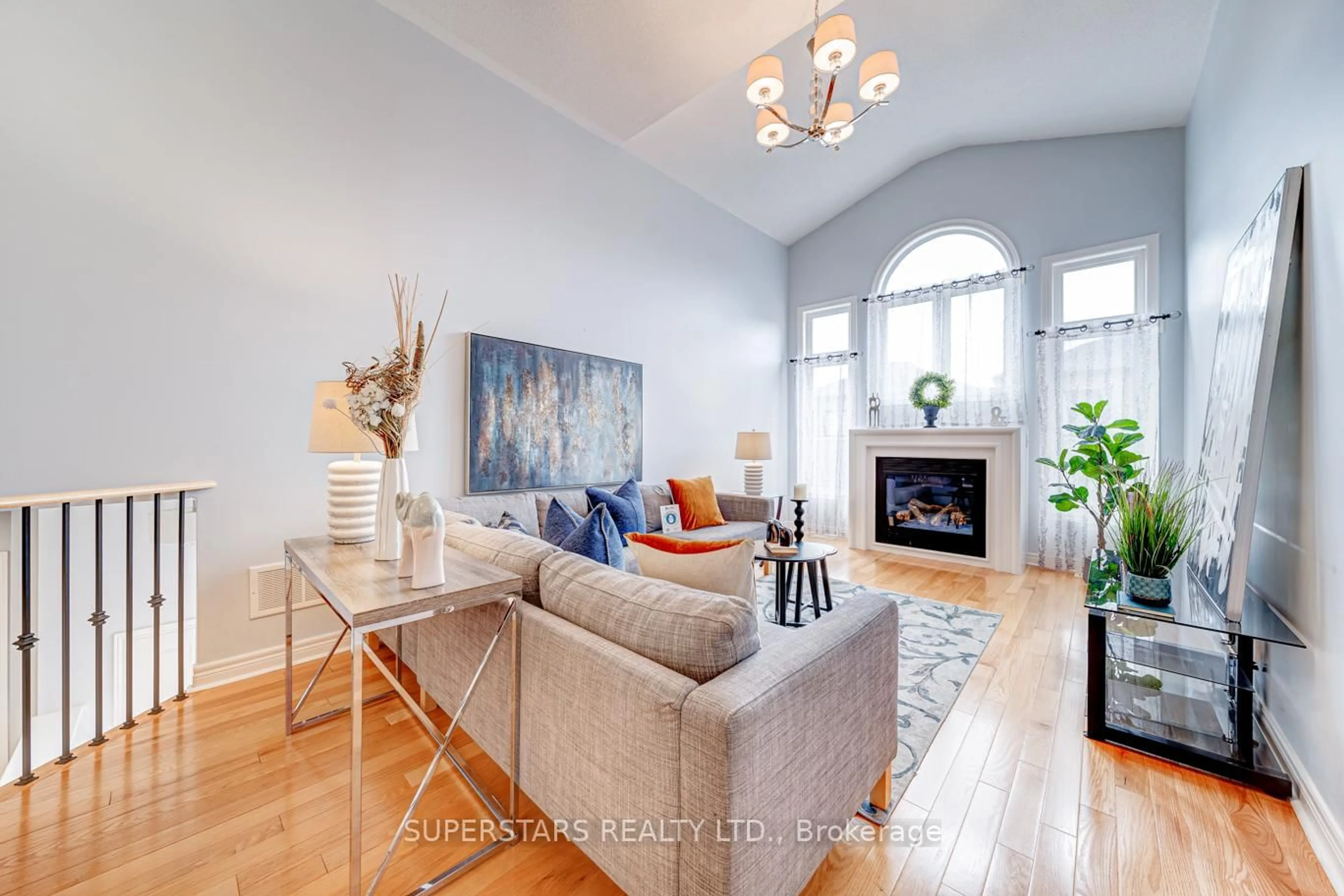 Living room with furniture, wood/laminate floor for 59 Honey Glen Ave, Markham Ontario L6B 0T9